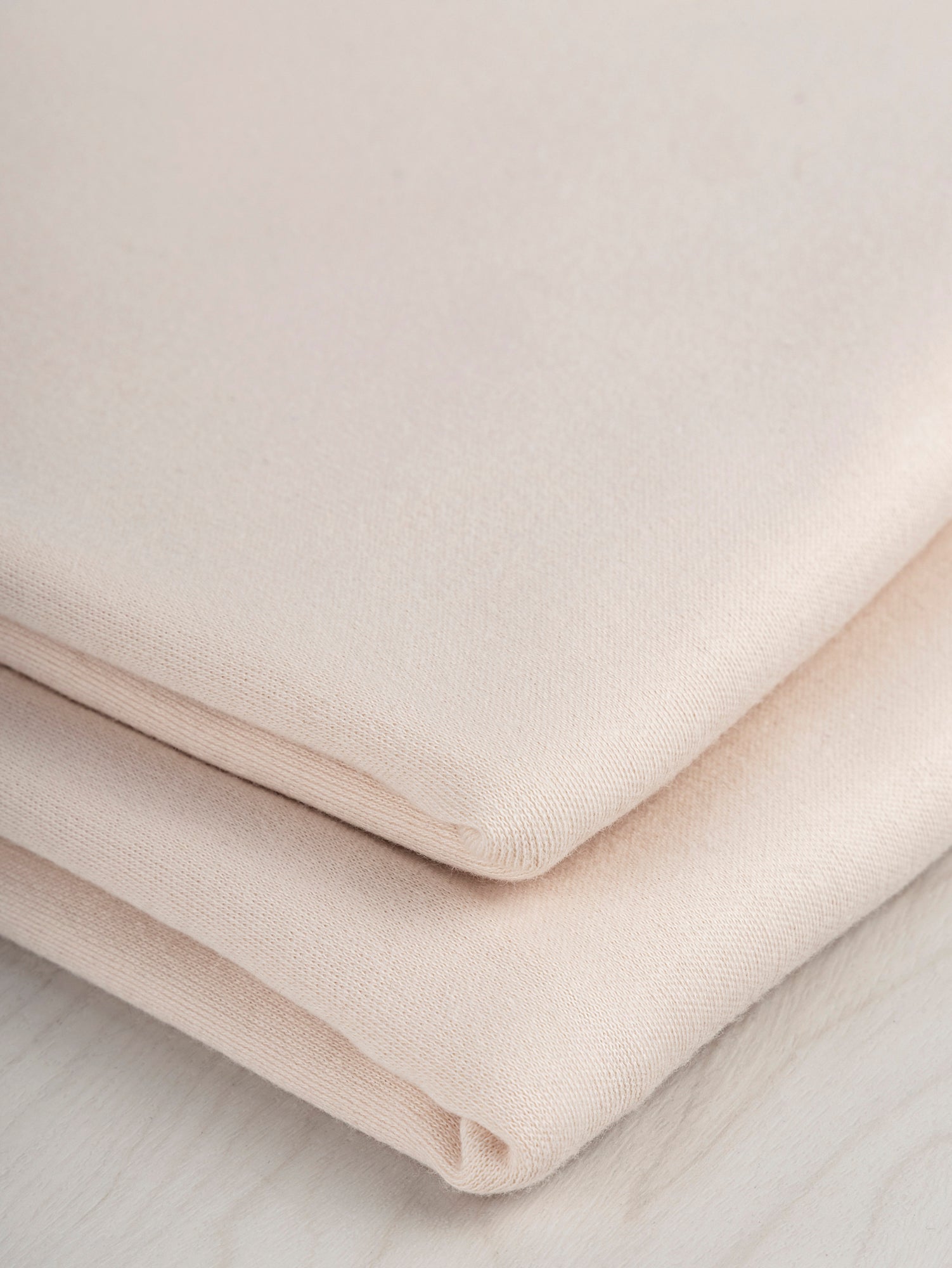 F-COT175-005-Luxe-Organic-Cotton-Jersey-Knit-Almond-Core-Fabrics-fold.JPG