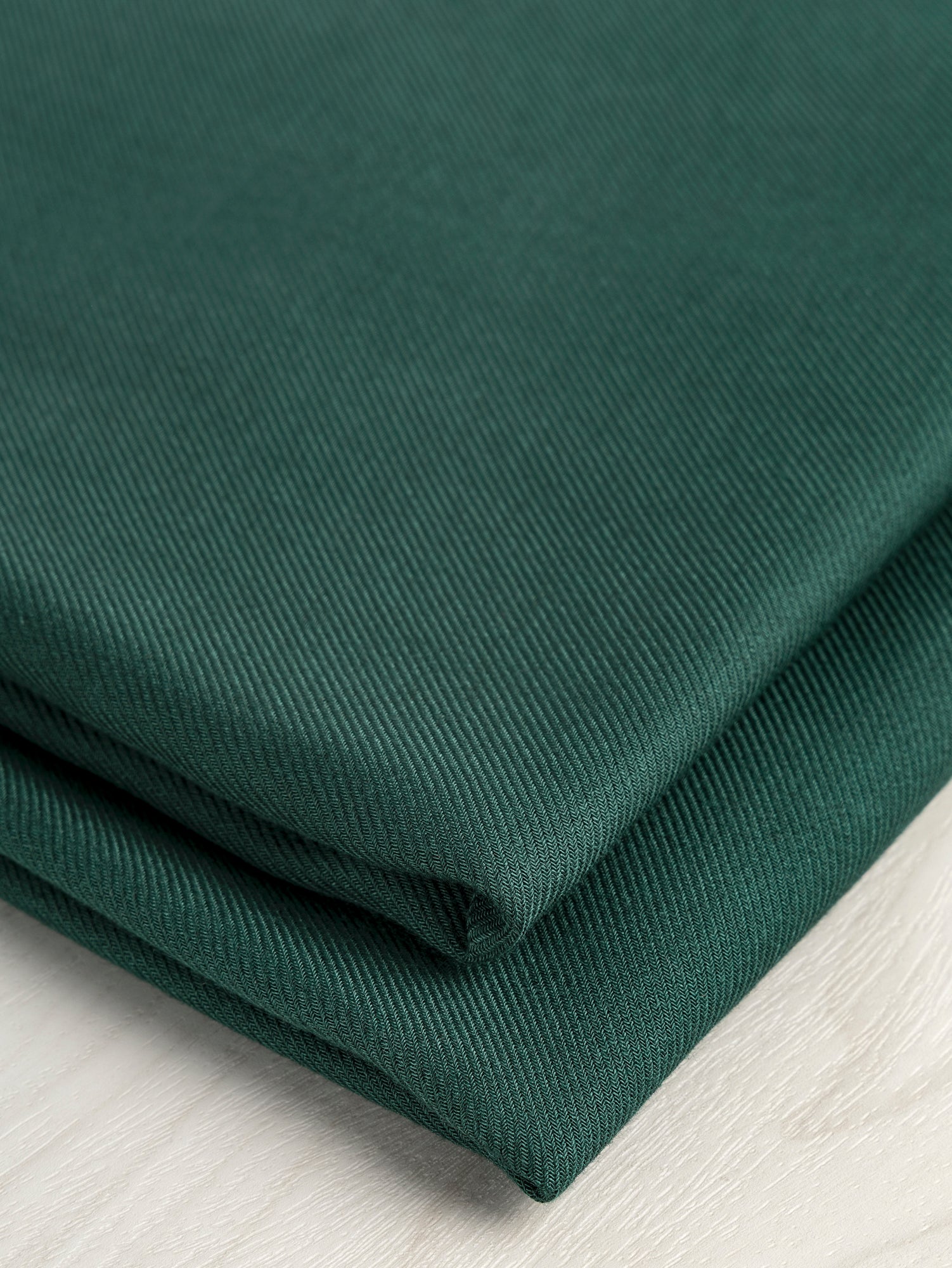 F-DEA058-Lyocell-Twill-Deadstock-Forest-Green-Core-Fabrics-fold.JPG