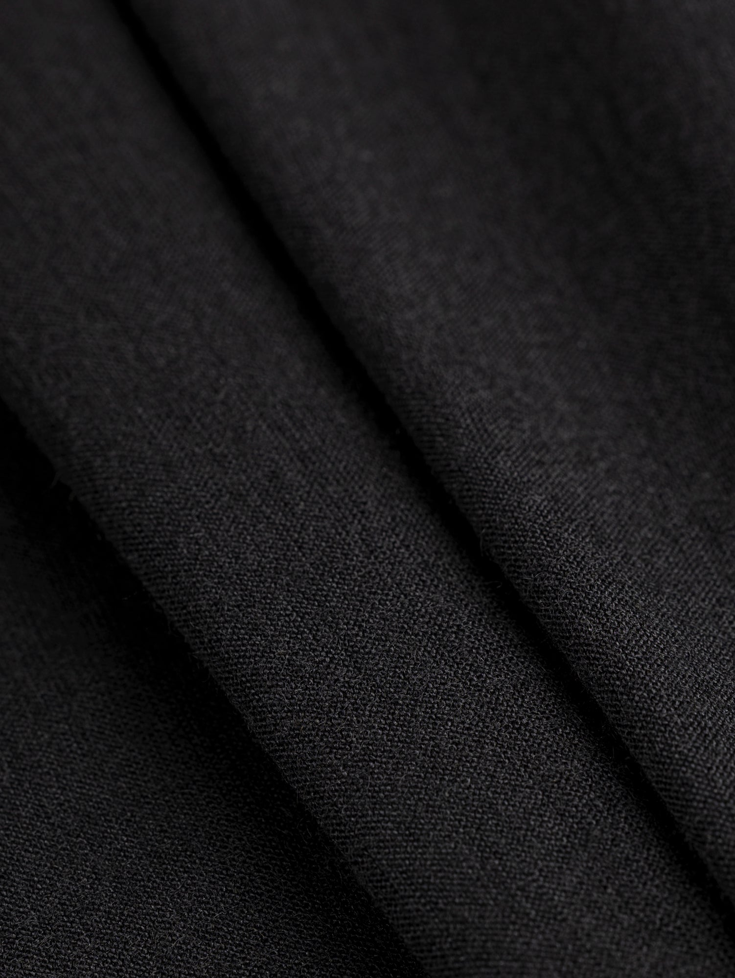 F-WOL128-001-Merino-Wool-Silk-Jersey-Knit-Deadstock-Black-Core-Fabrics-fold.JPG