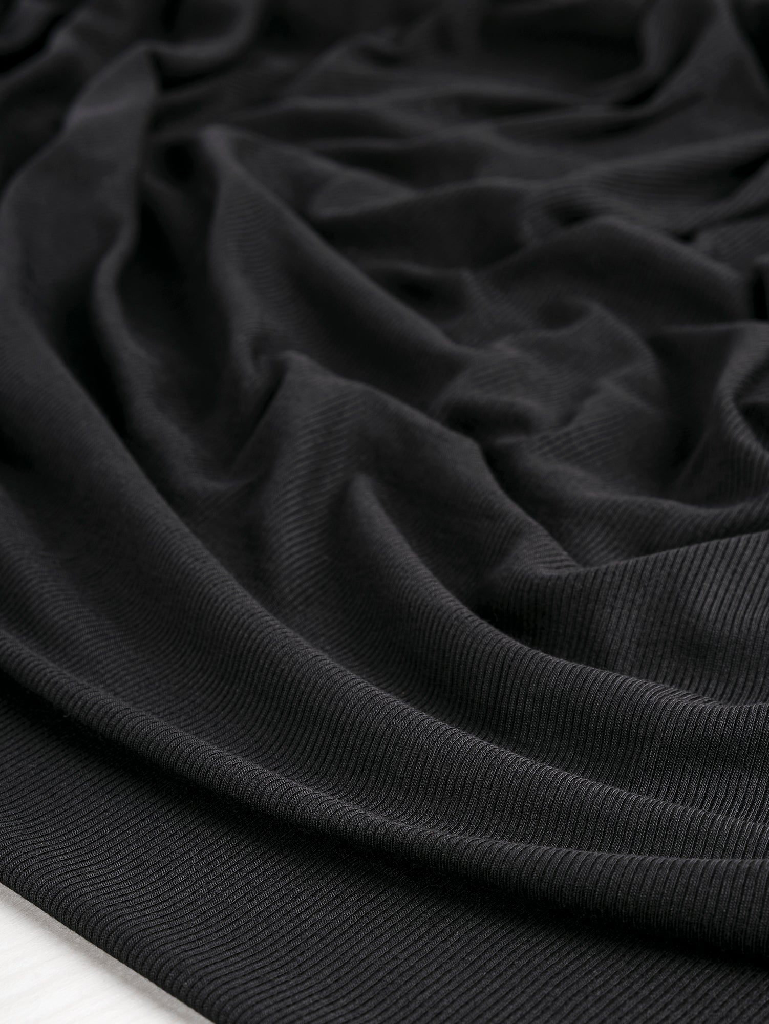 F-MOD004-001-MicroModal-Baby-Rib-Knit-Black-Core-Fabrics-scrunched.JPG