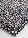 F-VIS242-Midnight-Ditzy-Floral-Print-Ecovero-Viscose-Black-Cream-Periwinkle-Core-Fabrics-fold.JPG