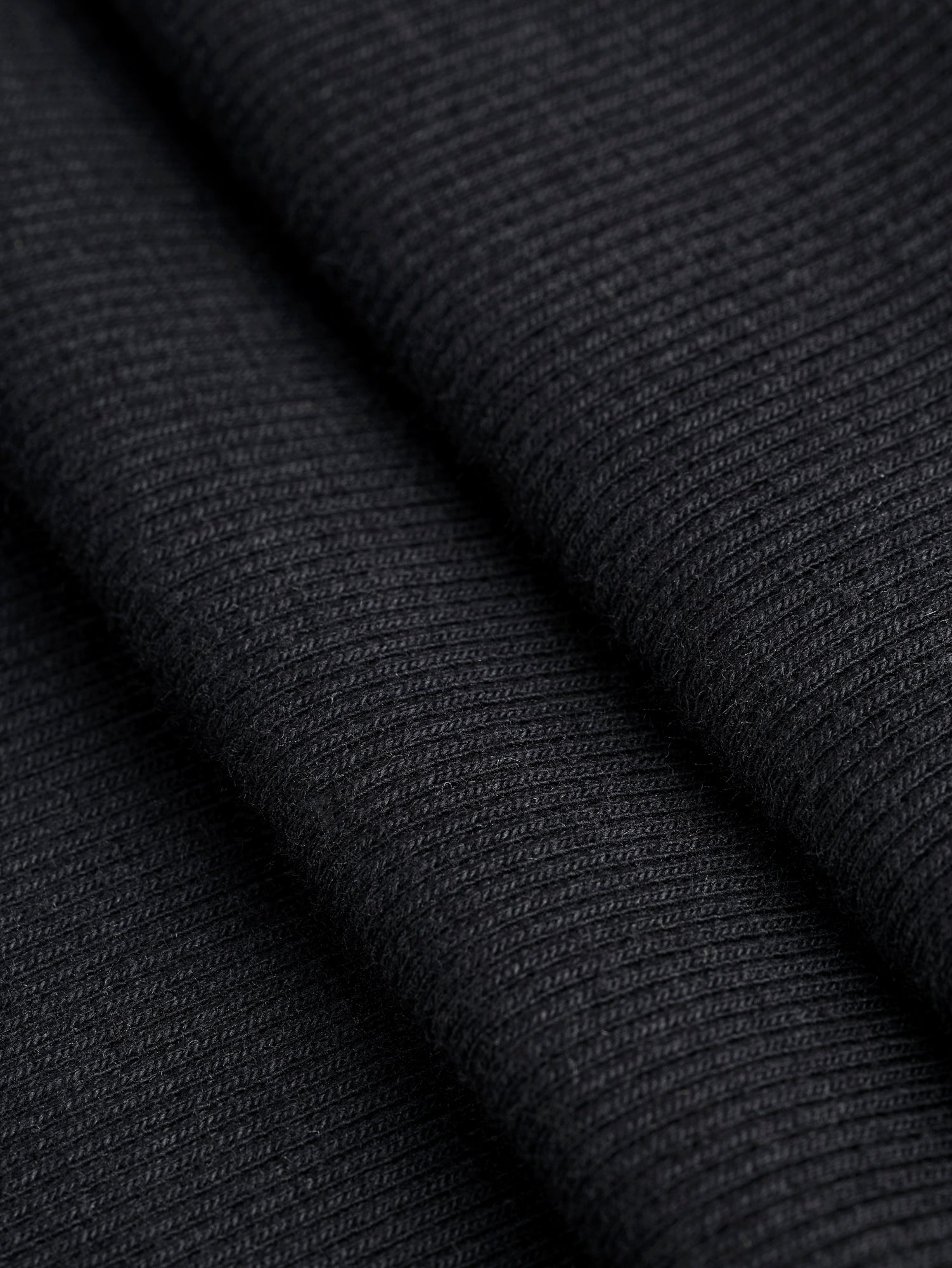 F-DEA086-004-Midweight-Organic-Cotton-2-1-Rib-Knit-Deadstock-Black-Core-Fabrics-fold.JPG