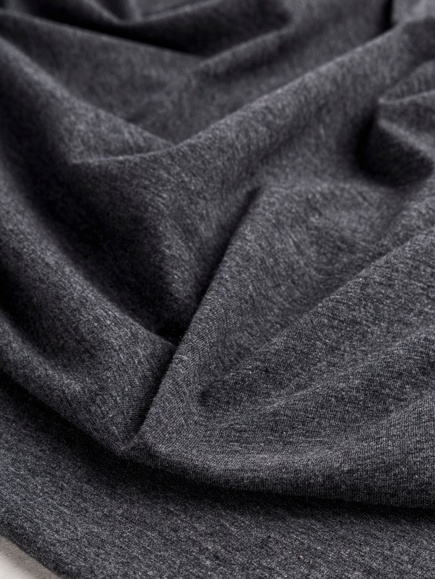 F-DEA085-001-Midweight-Organic-Cotton-Spandex-Jersey-Knit-Deadstock-Charcoal-Core-Fabrics-scrunched.JPG