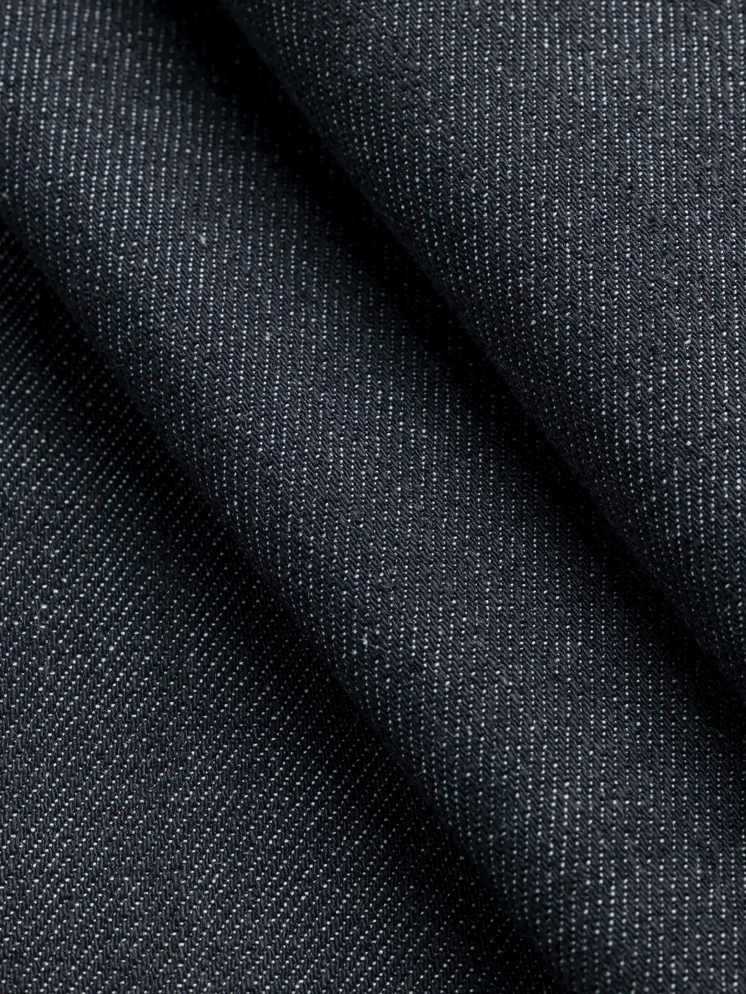 F-DEA154-Midweight-Slight-Stretch-Cotton-Denim-Deadstock-Dark-Indigo-Core-Fabrics-fold.webp