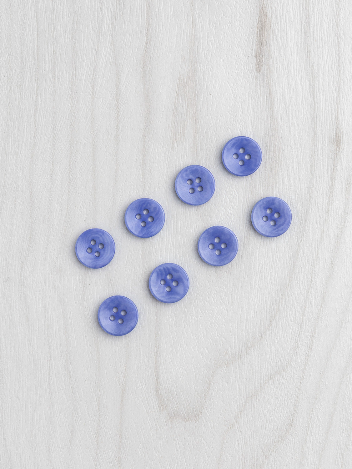 N-BUT021-007-Corozo-nut-button-4-hole-12mm-1_2-inch-8-pack-Periwinkle-Core-Fabrics.jpg