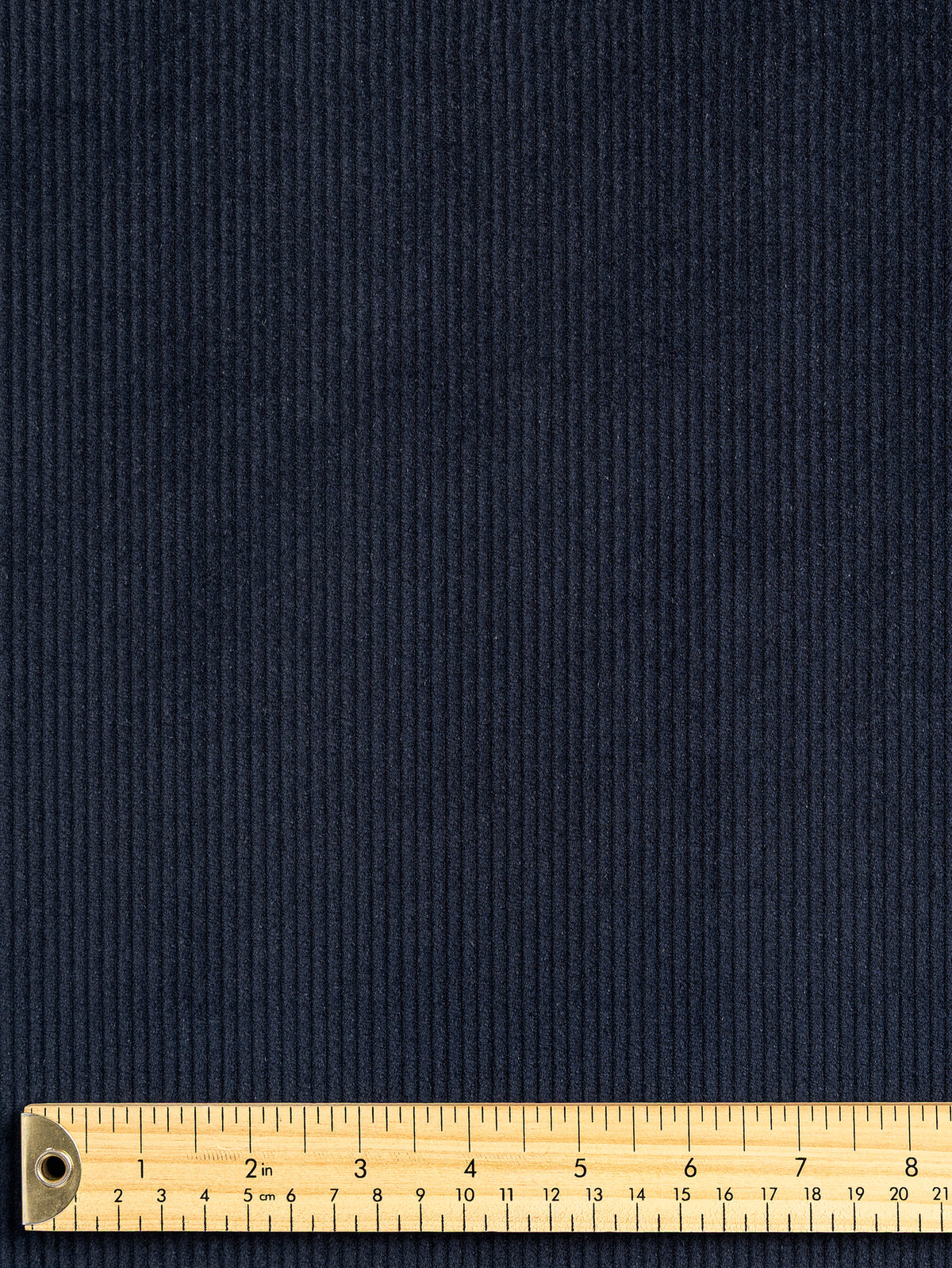 F-COT505-001-Non-Stretch-8-Wale-Cotton-Corduroy-Navy-Core-Fabrics-ruler.webp