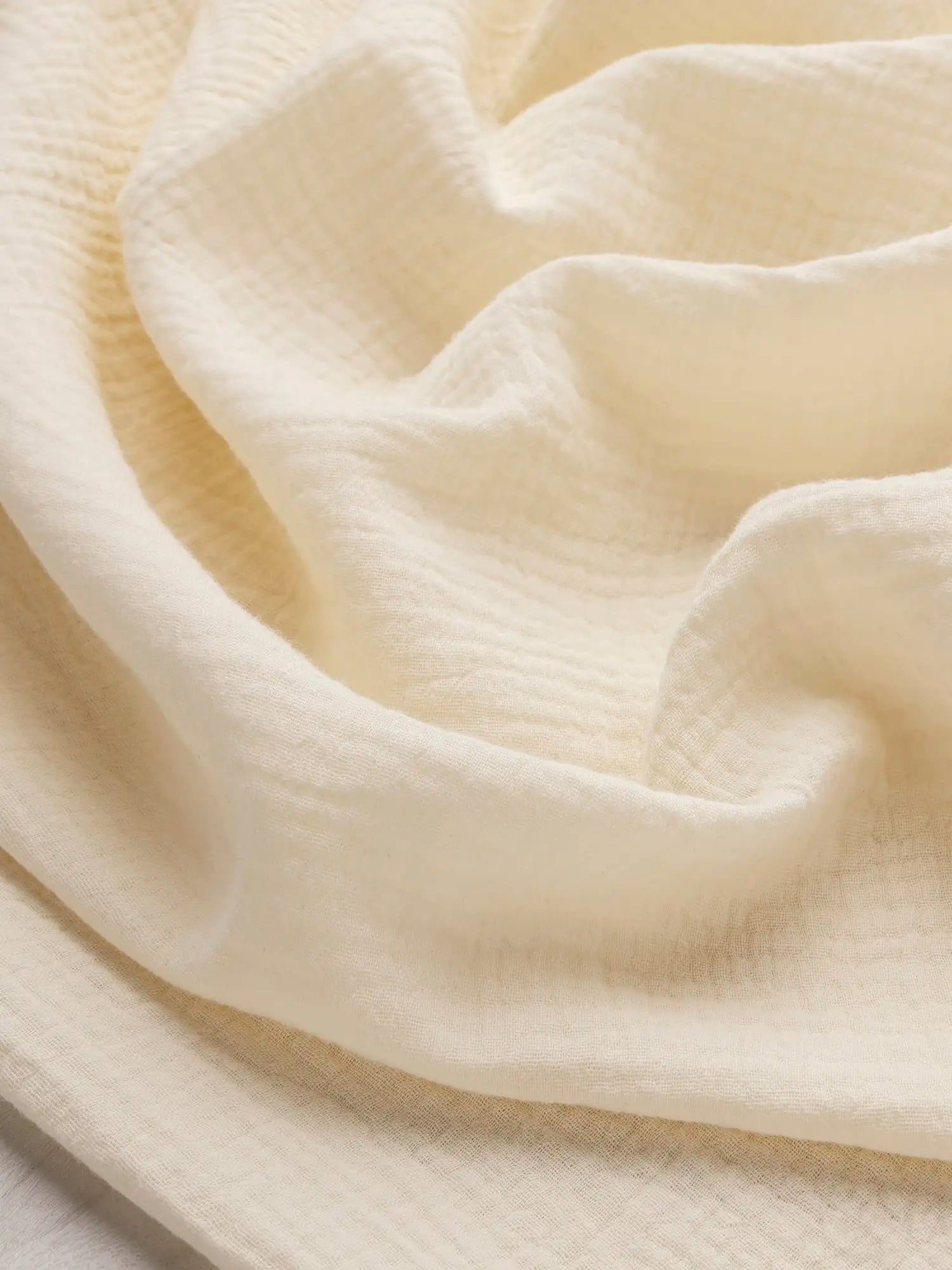 F-COT102-023-Organic-Cotton-Double-Gauze-Butter-Yellow-Core-Fabrics-scrunched.webp