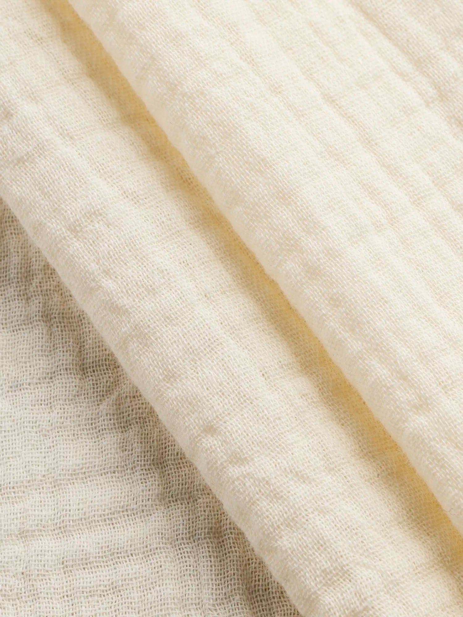 F-COT102-023-Organic-Cotton-Double-Gauze-Butter-Yellow-Core-Fabrics-fold.webp