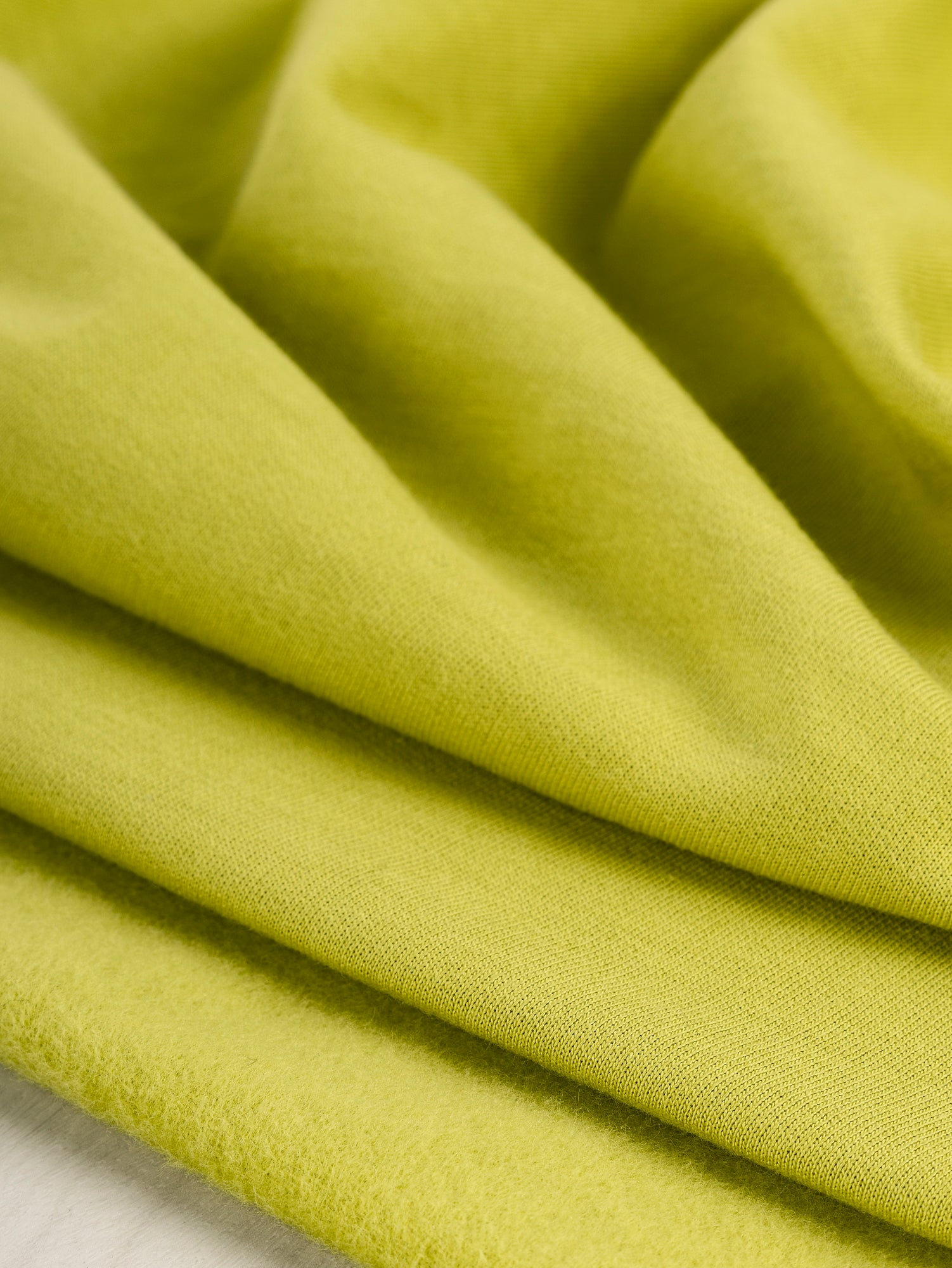 F-COT058-013-Organic-Cotton-Fleece-Chartreuse-Core-Fabrics-scrunched.JPG