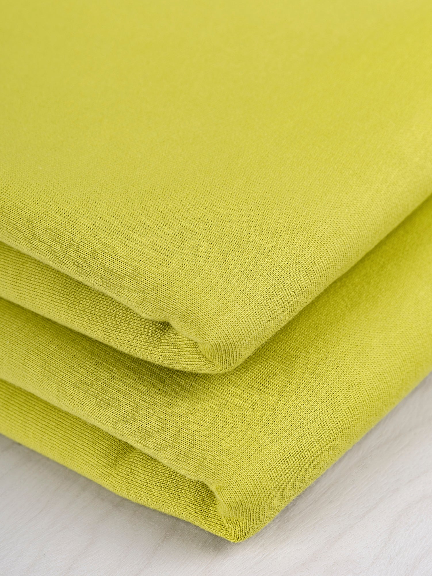 F-COT058-013-Organic-Cotton-Fleece-Chartreuse-Core-Fabrics-fold.JPG