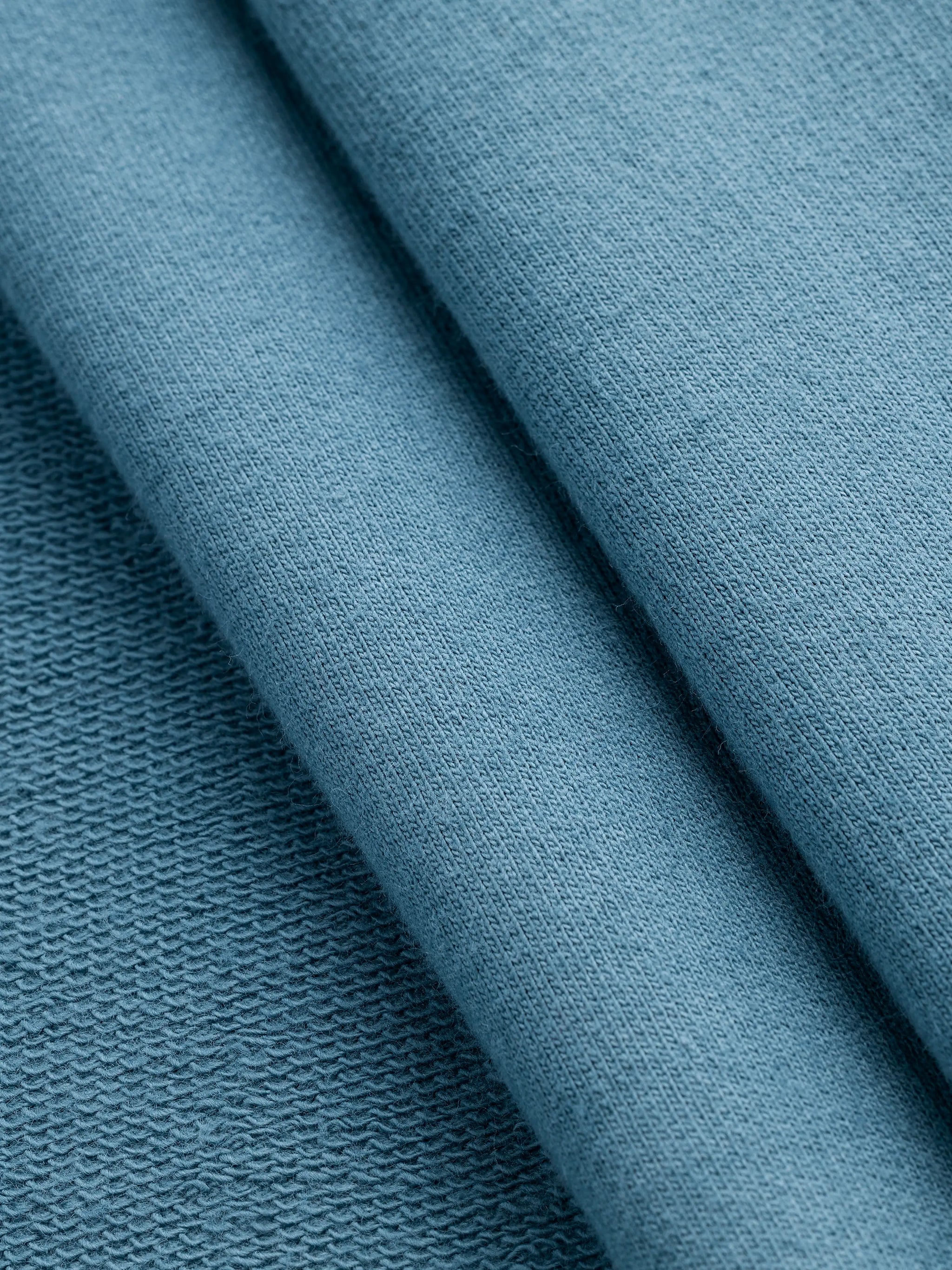 F-COT466-011-Organic-Cotton-French-Terry-Steel-Blue-Core-Fabrics-fold.webp