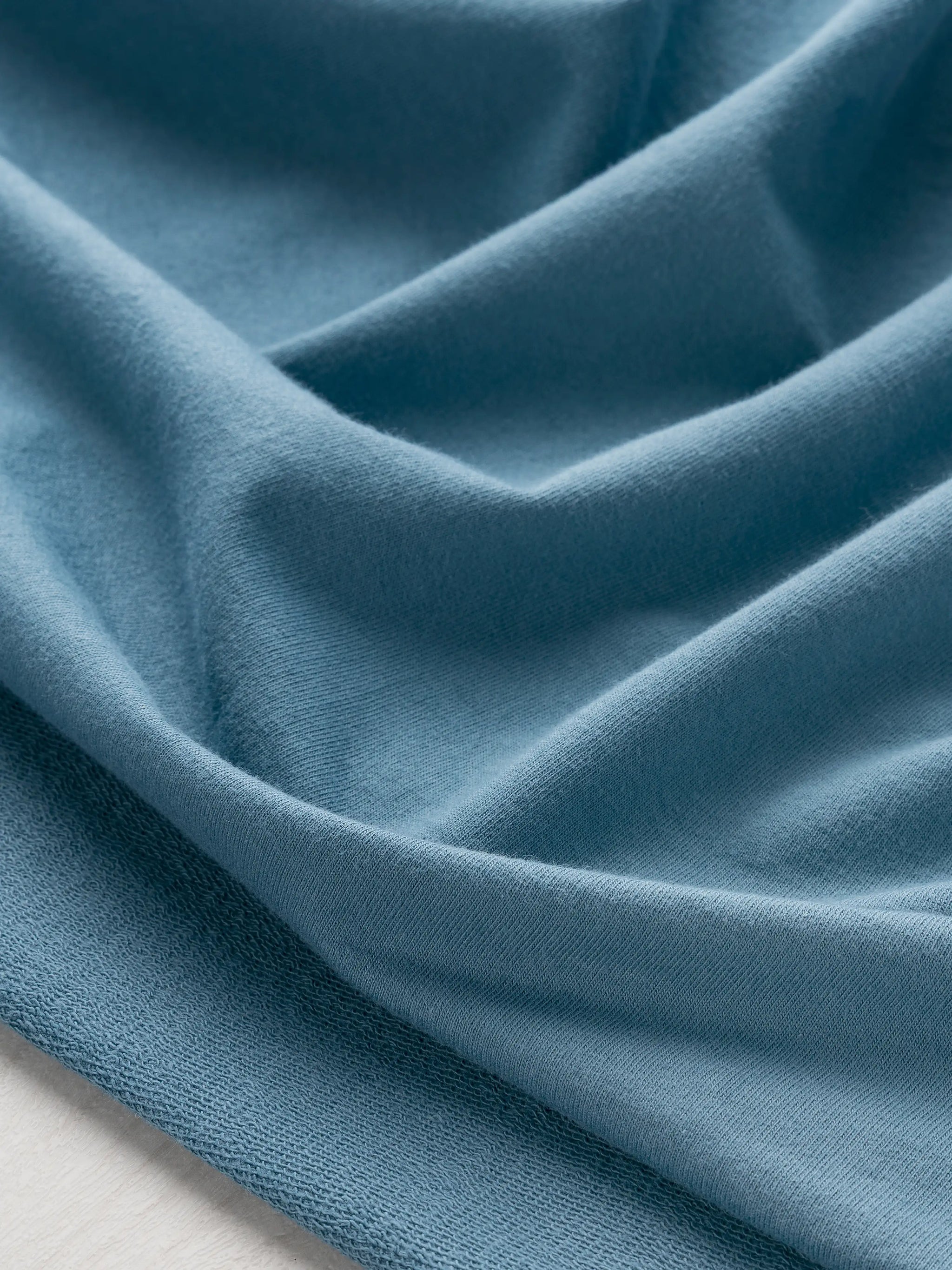 F-COT466-011-Organic-Cotton-French-Terry-Steel-Blue-Core-Fabrics-scrunched.webp