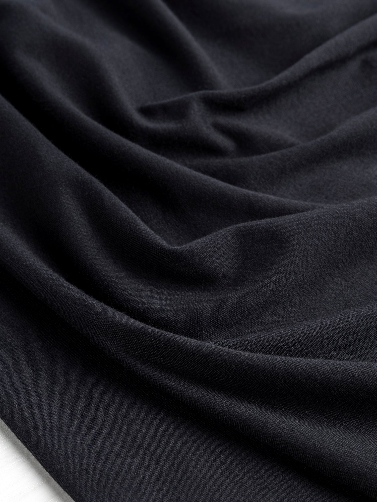 F-COT409-002 - Organic Cotton Spandex Jersey - Black - Core Fabrics- Scrunched.JPG