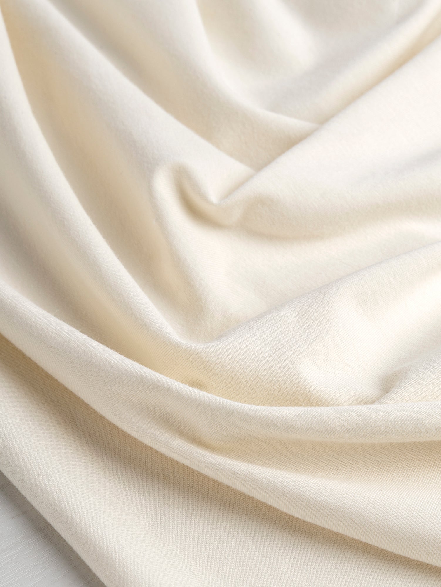 F-COT409-001 - Organic Cotton Spandex Jersey - Cream - Core Fabrics-Scrunched.JPG
