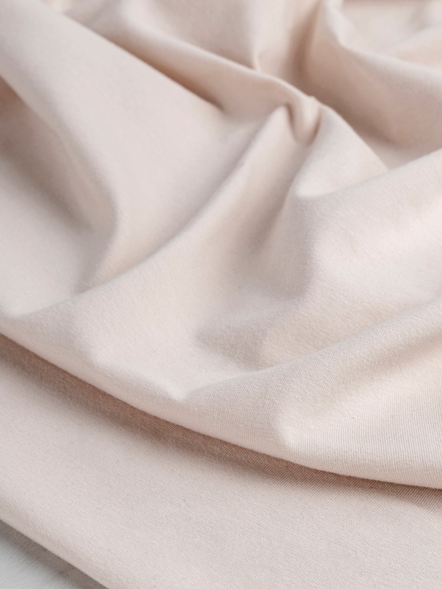 F-COT363-005-Organic-Cotton-Spandex-Jersey-Knit-Blush-Core-Fabrics-scrunched.JPG
