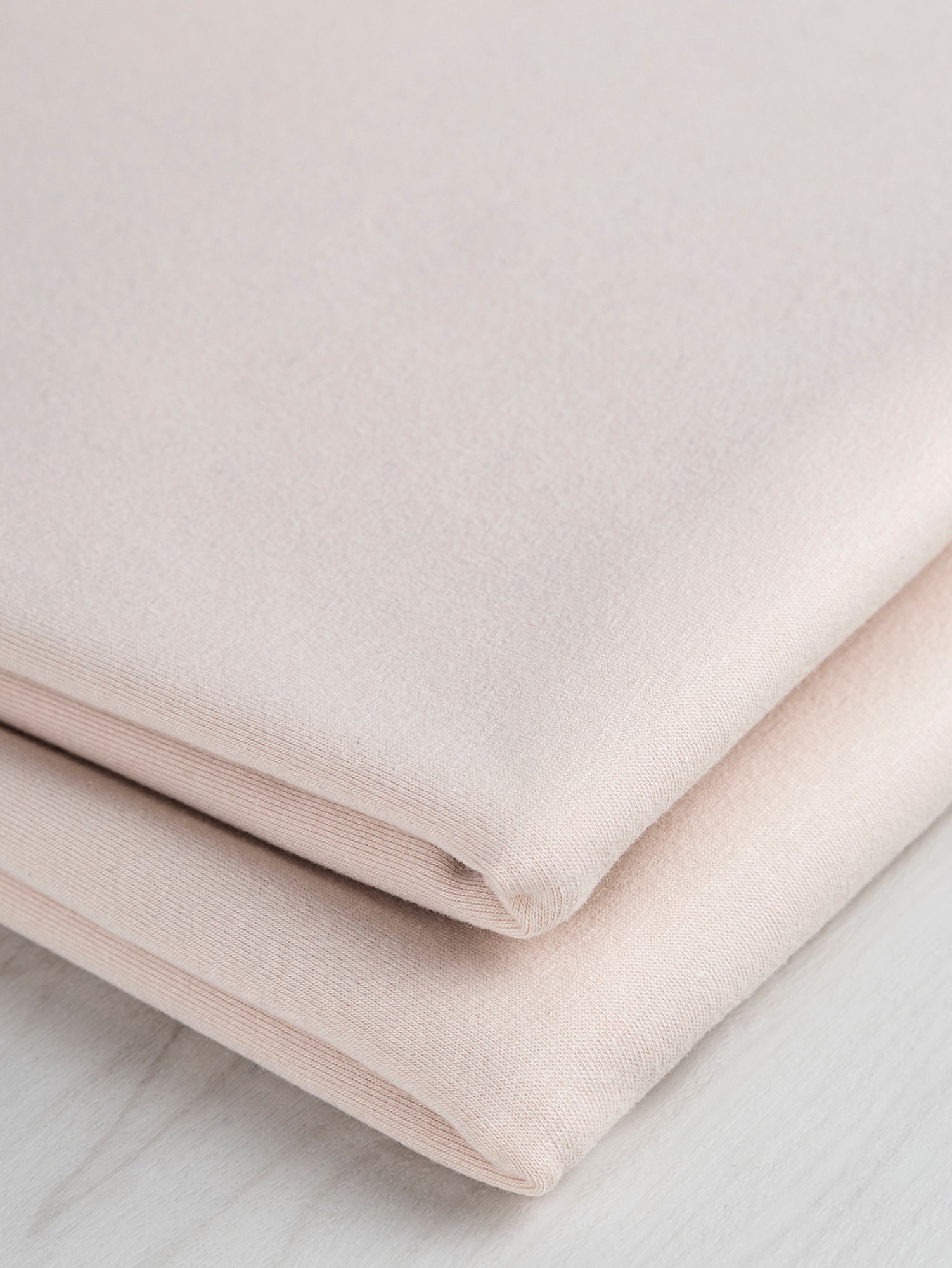 F-COT363-005-Organic-Cotton-Spandex-Jersey-Knit-Blush-Core-Fabrics-fold.JPG