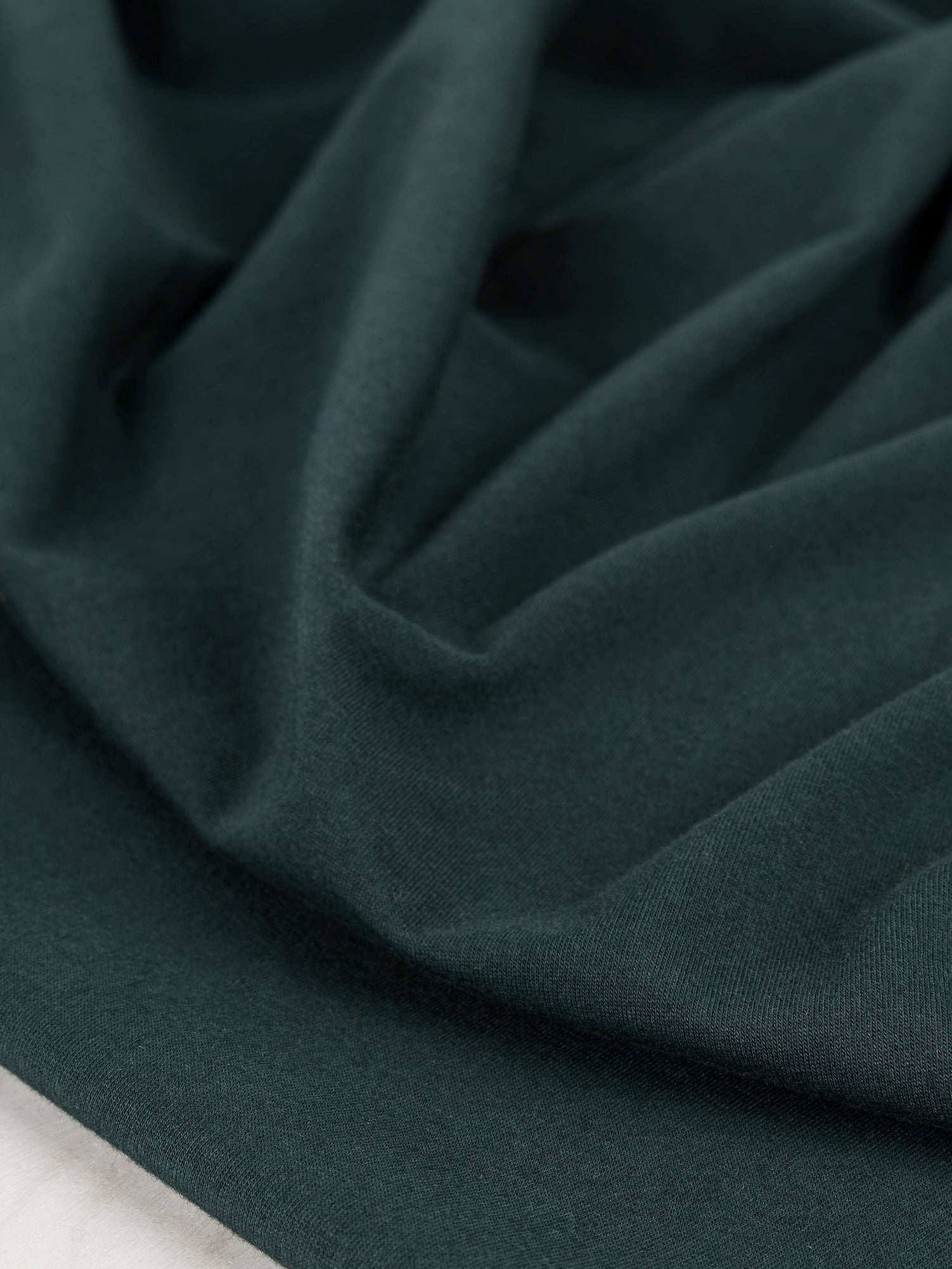 F-COT363-003-Organic-Cotton-Spandex-Jersey-Knit-Evergreen-Core-Fabrics-scrunched.JPG