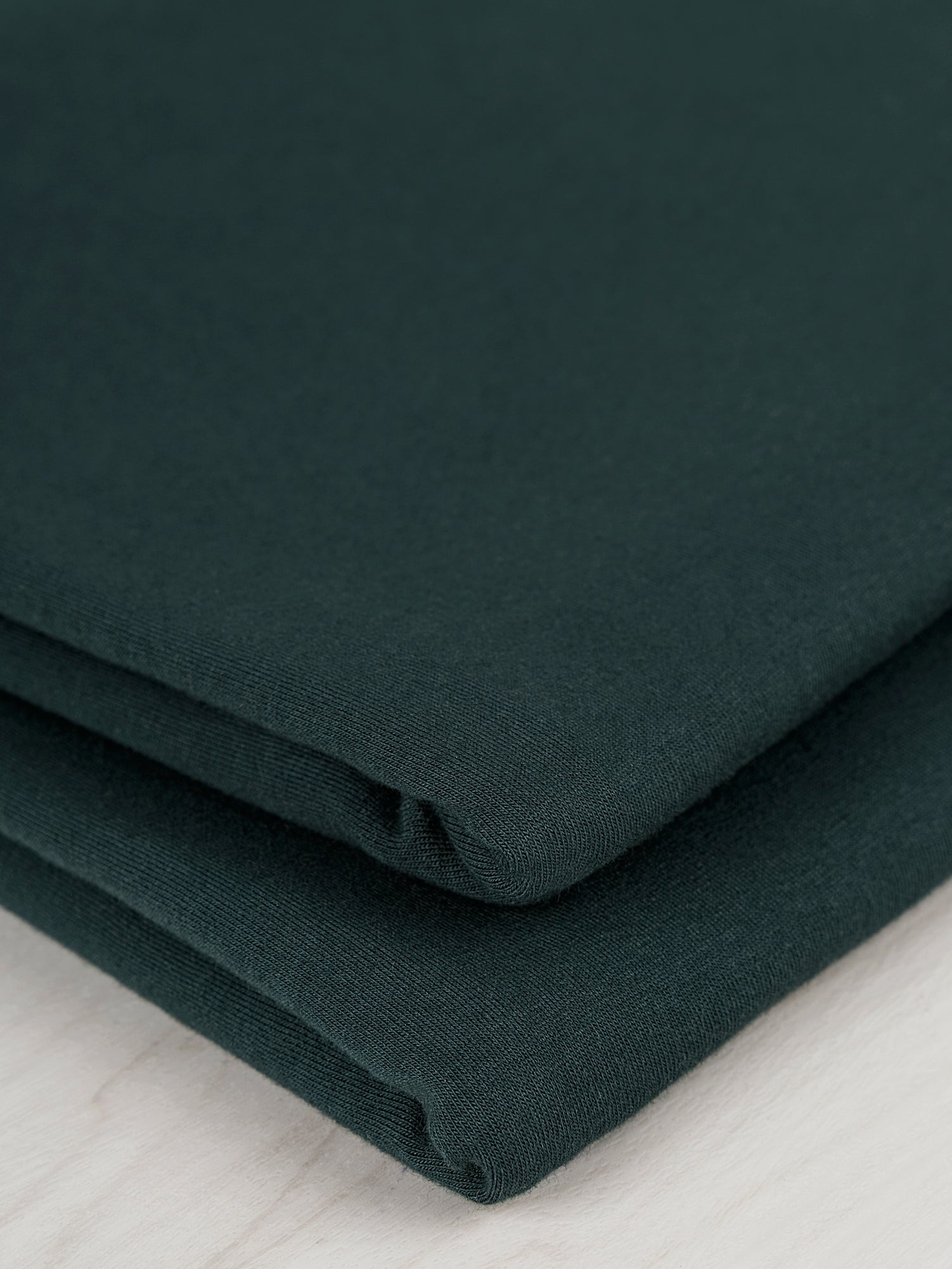 F-COT363-003-Organic-Cotton-Spandex-Jersey-Knit-Evergreen-Core-Fabrics-fold.JPG