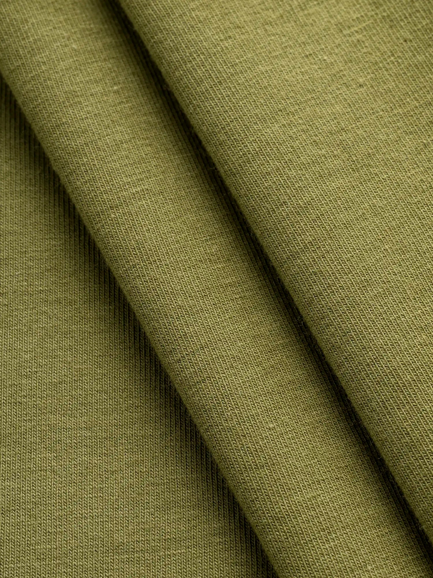 F-COT363-022-Organic-Cotton-Spandex-Jersey-Knit-Olive-Core-Fabrics-fold.webp
