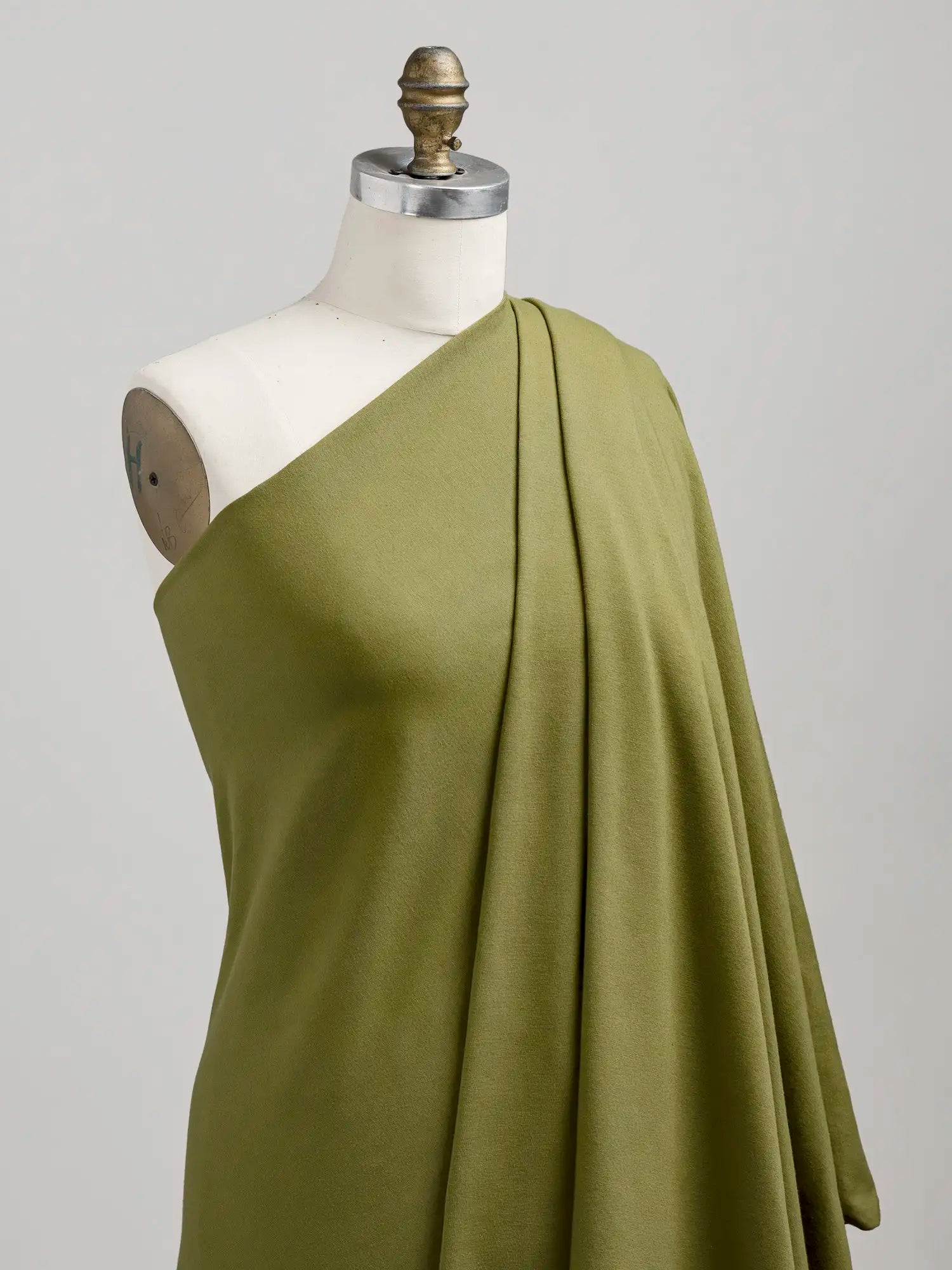 F-COT363-022-Organic-Cotton-Spandex-Jersey-Knit-Olive-Core-Fabrics-draped.webp