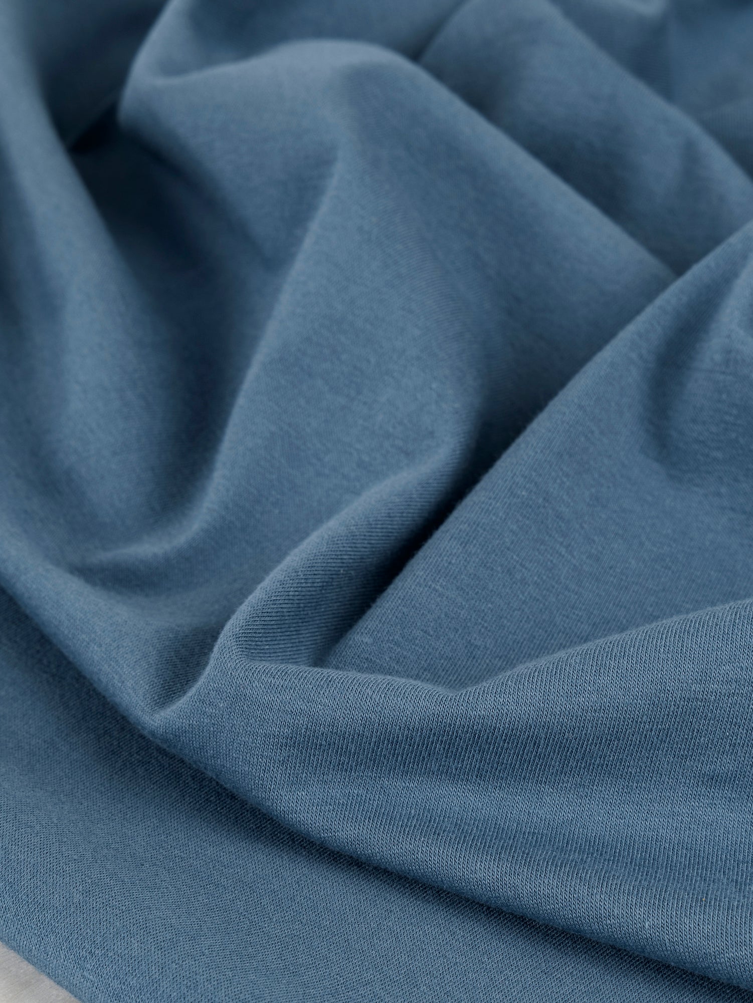 F-COT363-011-Organic-Cotton-Spandex-Jersey-Knit-Steel-Blue-Core-Fabrics-scrunched.JPG