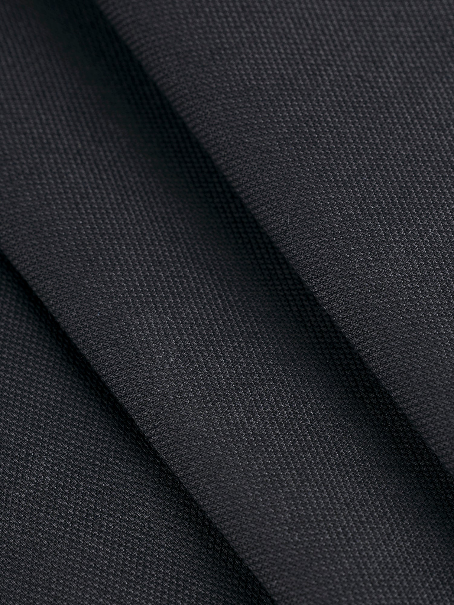 F-COT349-Organic-Cotton-Stretch-Canvas-Black-Core-Fabrics-fold.JPG