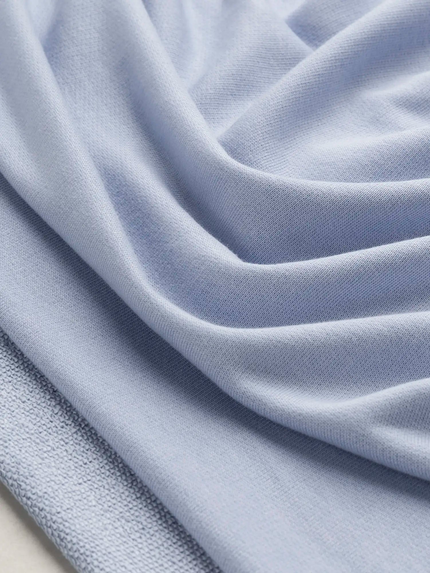 F-DEA234-Organic-Cotton-Tencel-French-Terry-Deadstock-Powder Blue-Core-Fabrics-scrunched.webp