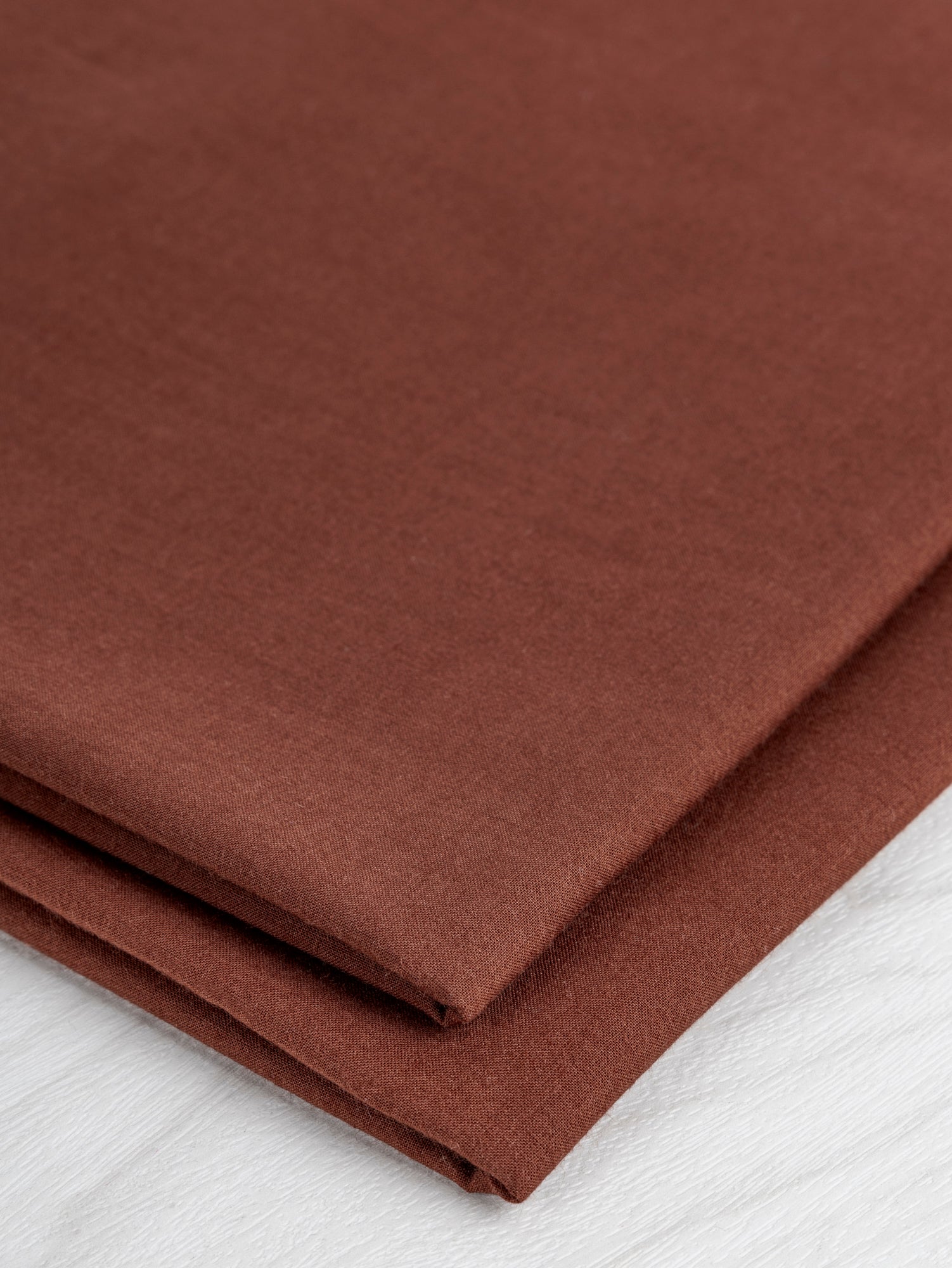 F-COT340-006-Organic-Cotton-Voile-Chestnut-Core-Fabrics-fold