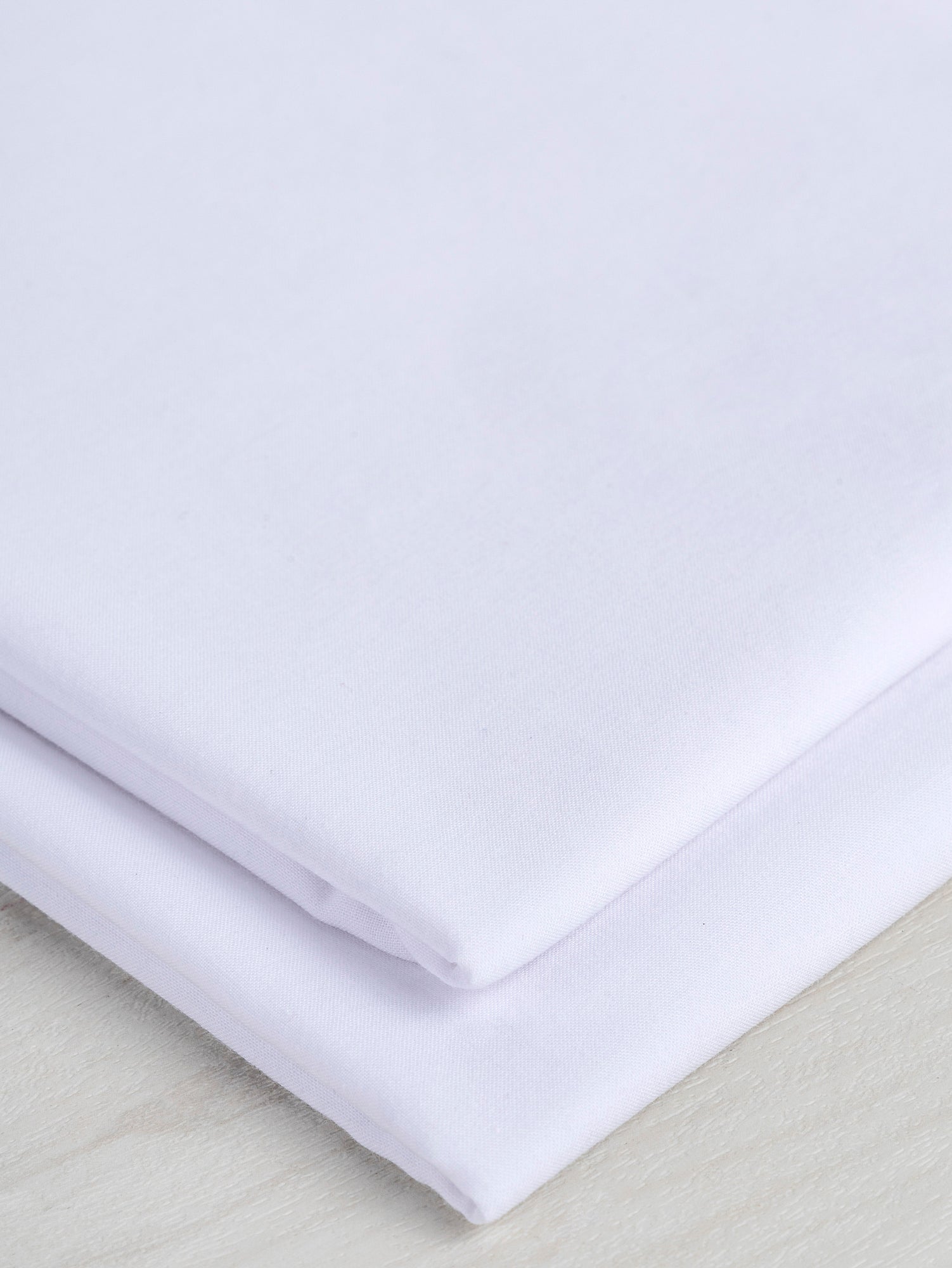 F-COT340-001-Organic-Cotton-Voile-White-Core-Fabrics-fold