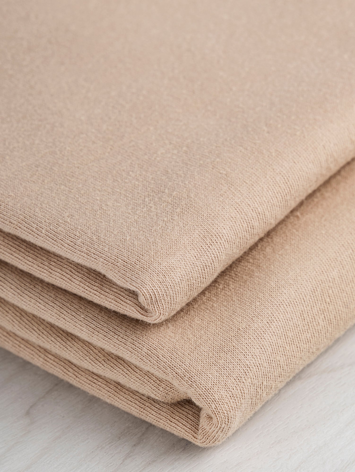 F-COT361-012-Organic-Cotton-Washed-Jersey-Knit-Beige-Core-Fabrics-fold.JPG