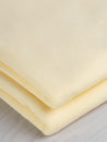 F-COT361-015-Organic-Cotton-Washed-Jersey-Knit-Butter-Yellow-Core-Fabrics-fold.JPG