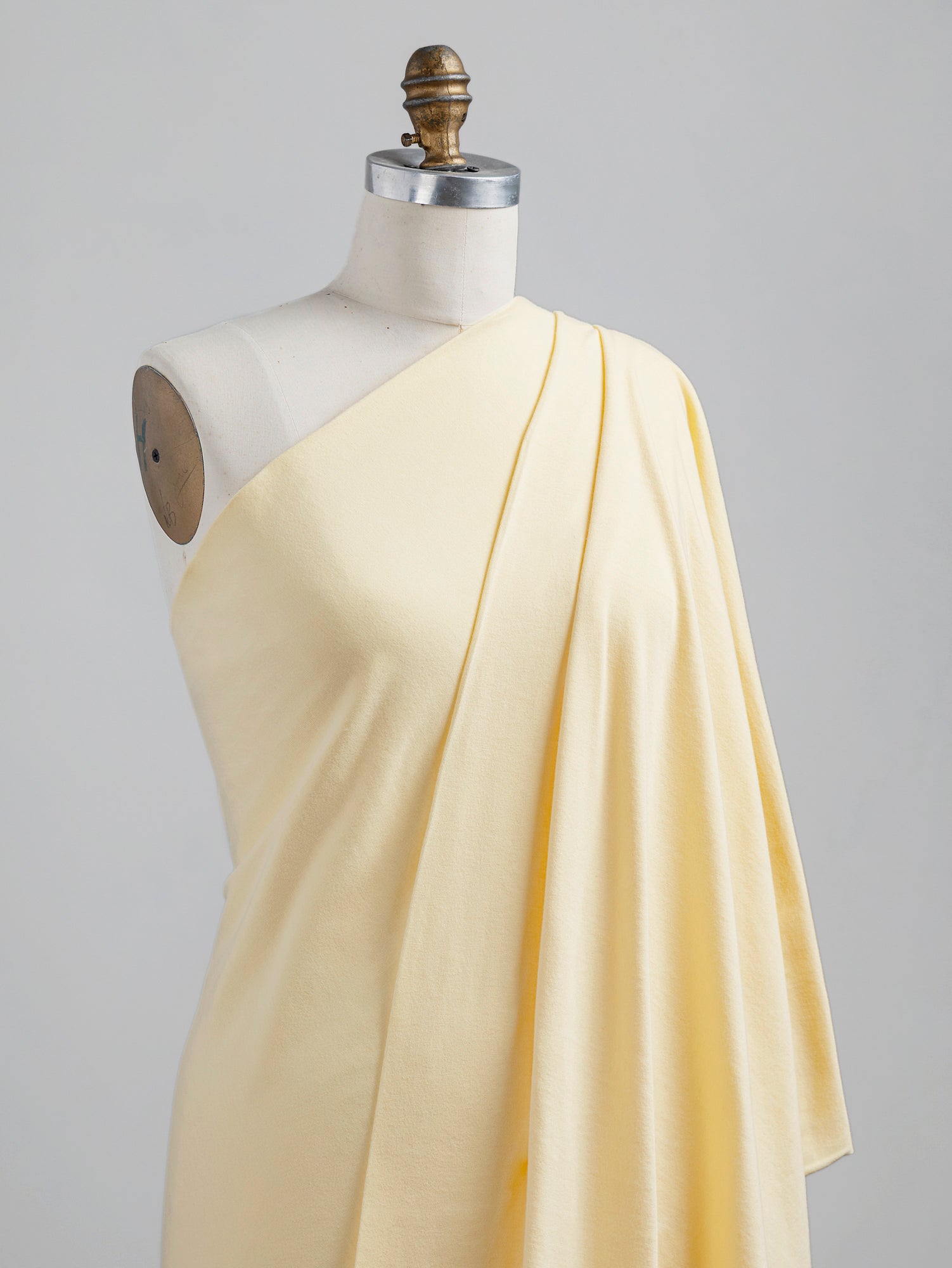 F-COT361-015-Organic-Cotton-Washed-Jersey-Knit-Butter-Yellow-Core-Fabrics-draped.JPG