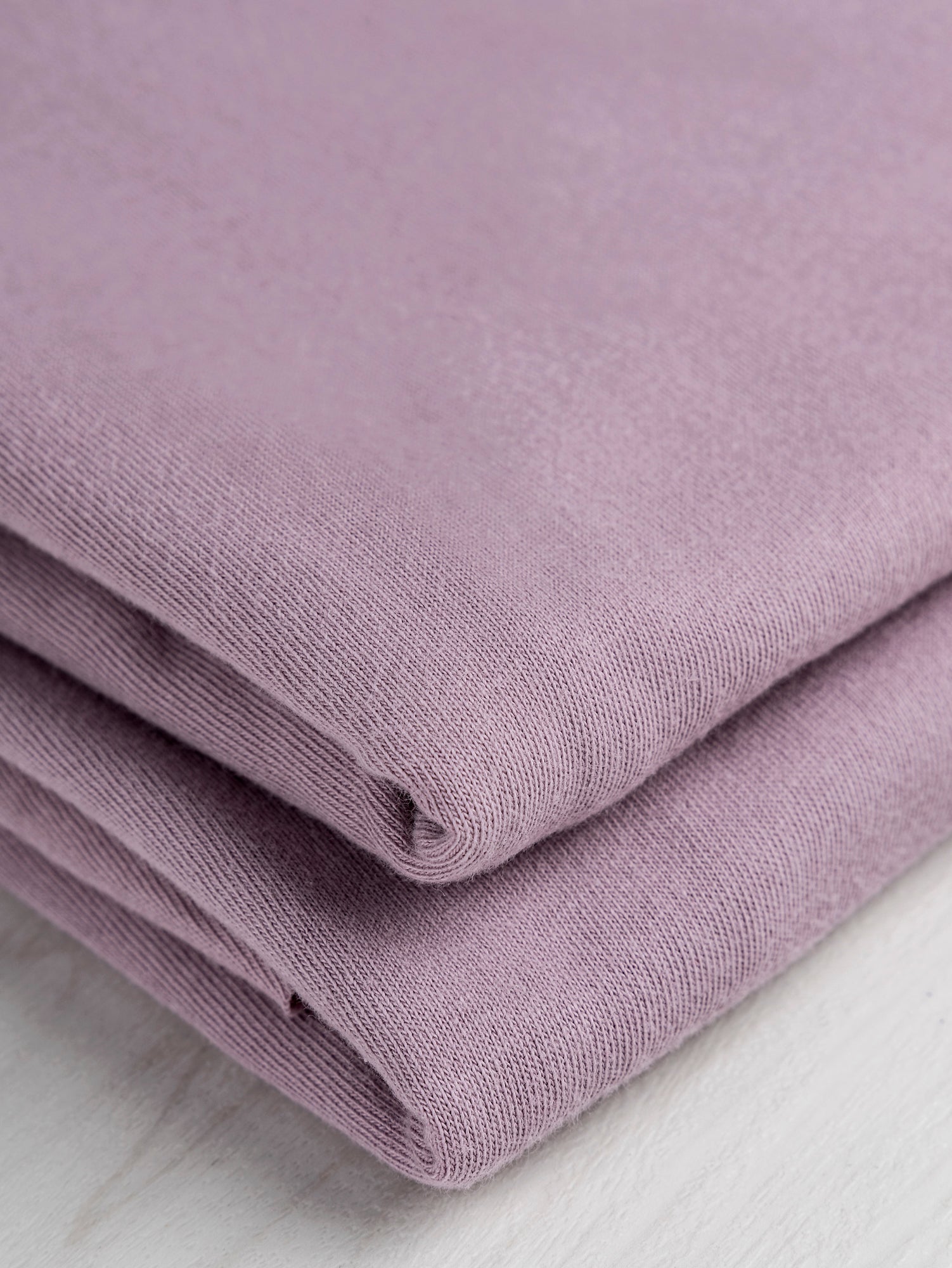 F-COT361-006-Organic-Cotton-Washed-Jersey-Knit-Lilac-Core-Fabrics-fold.JPG