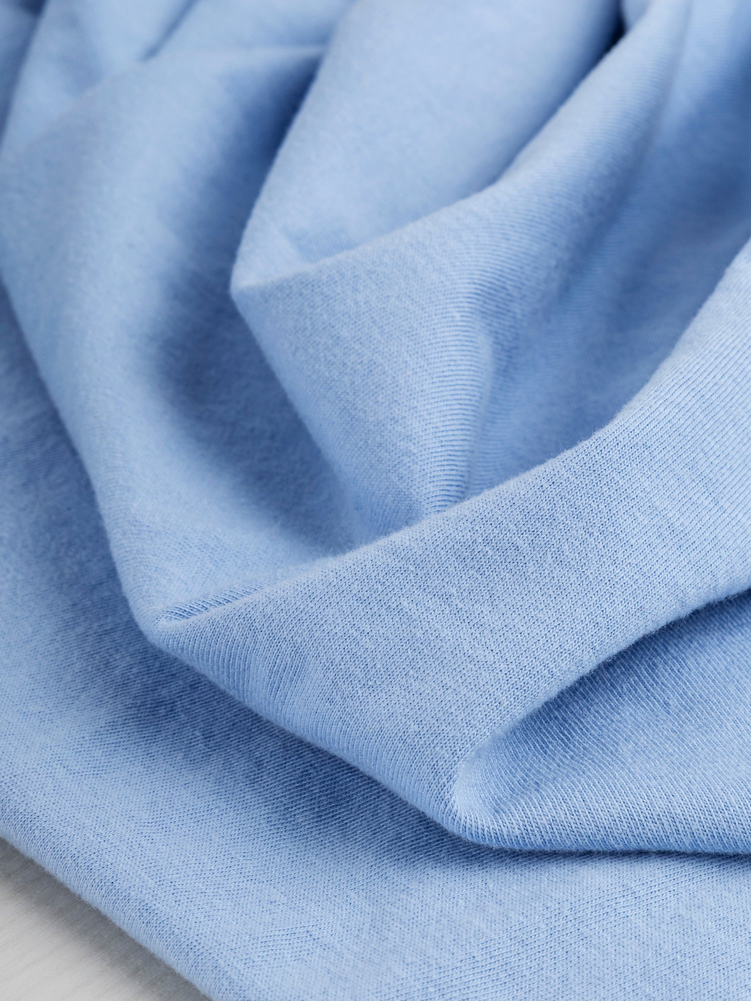 F-COT361-016-Organic-Cotton-Washed-Jersey-Knit-Powder-Blue-Core-Fabrics-scrunched.JPG