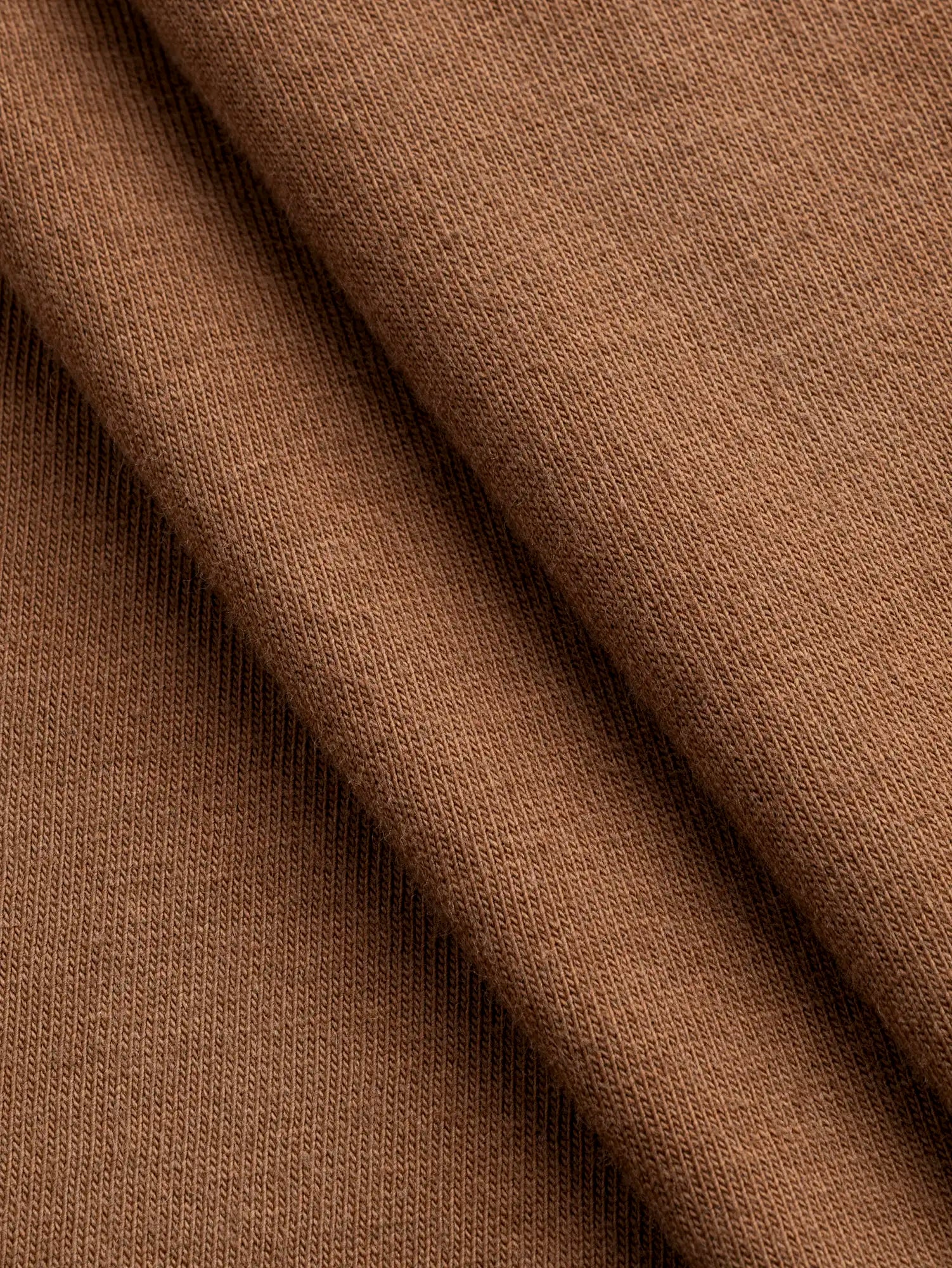 F-COT361-024-Organic-Cotton-Washed-Jersey-Knit-Toffee-Core-Fabrics-fold.webp