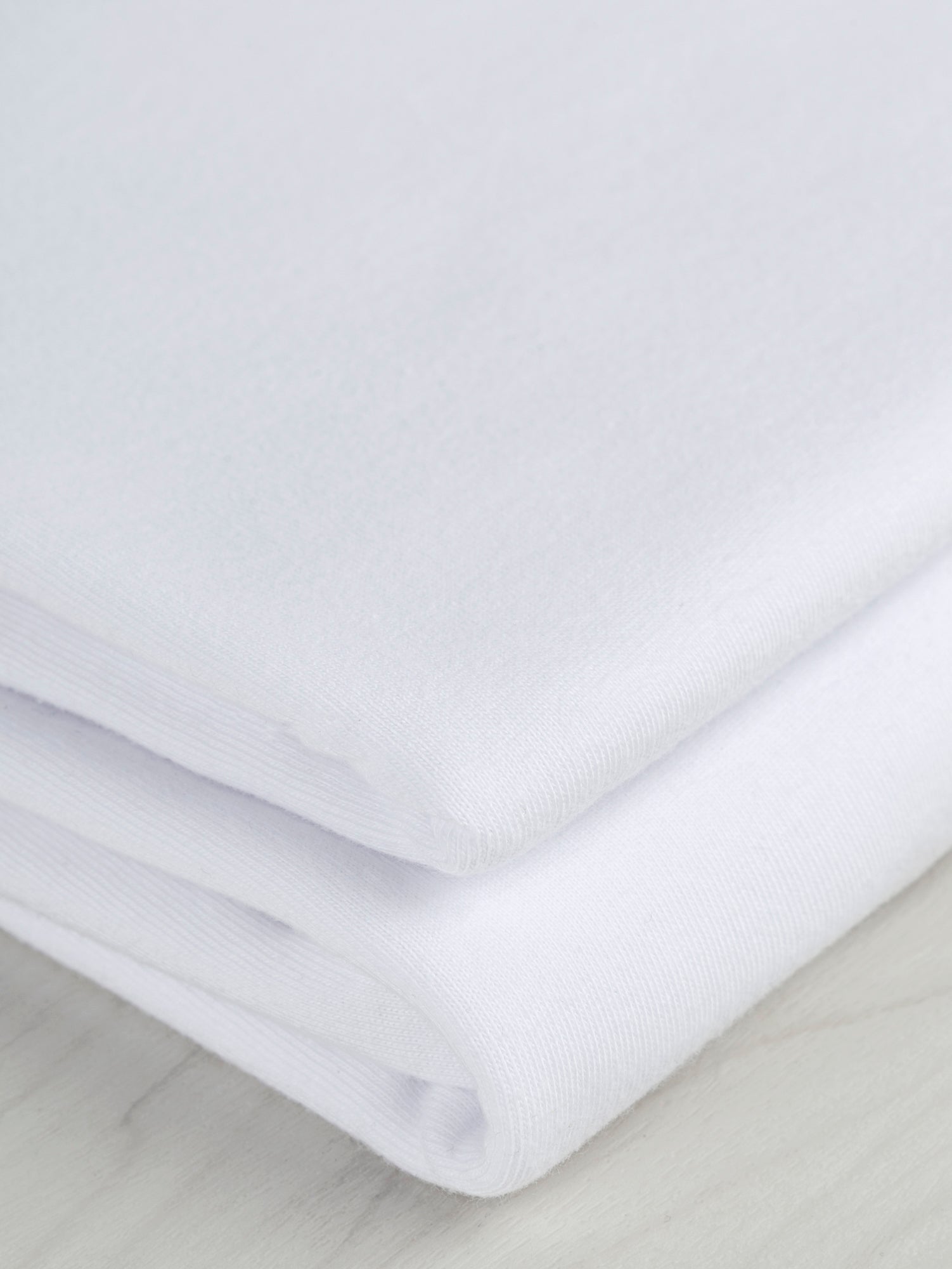 F-COT361-017-Organic-Cotton-Washed-Jersey-Knit-White-Core-Fabrics-fold.JPG