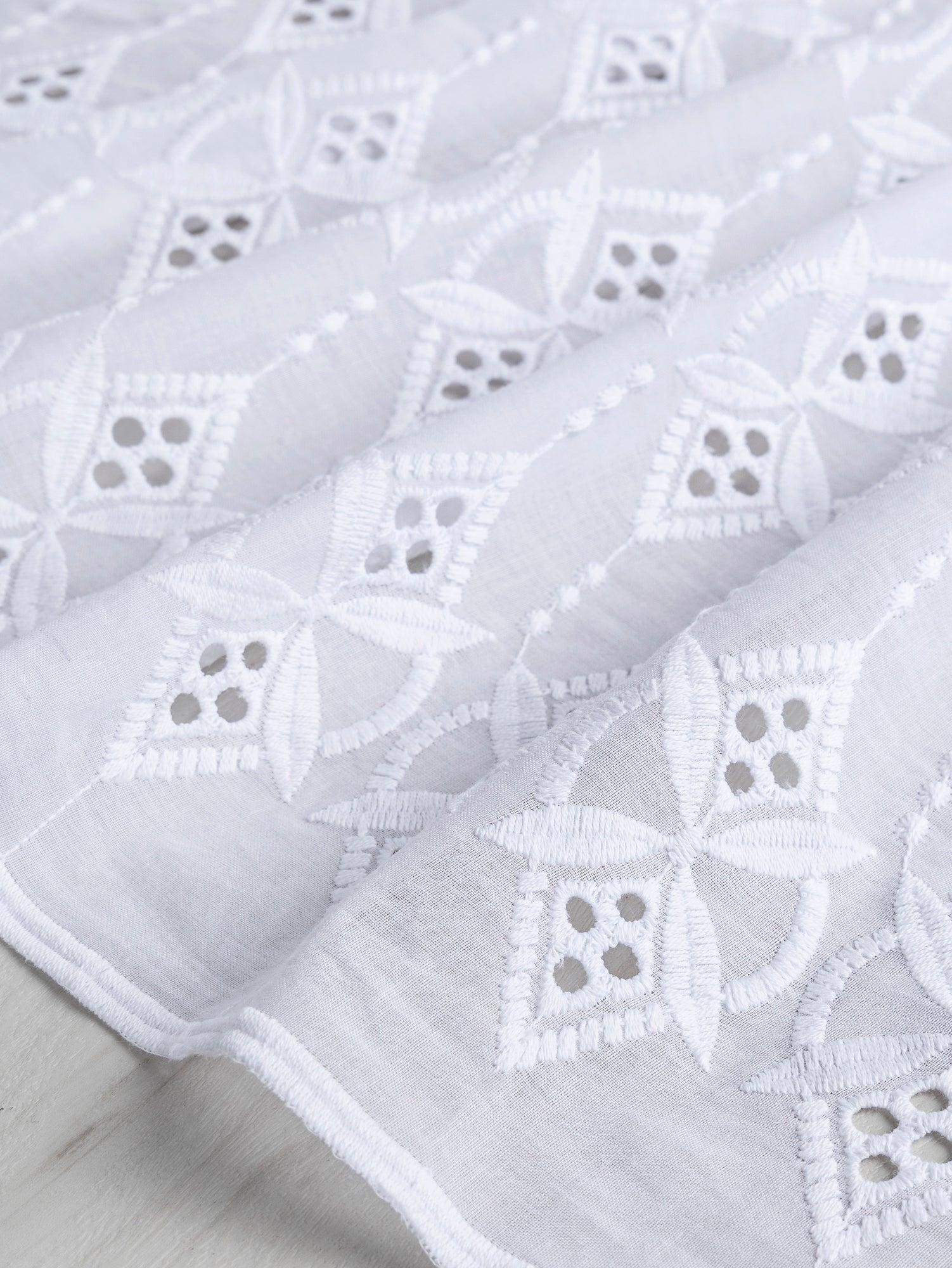 F-COT335-001-Ornament-Cotton-Eyelet-Deadstock-White-Core-Fabrics-scrunched