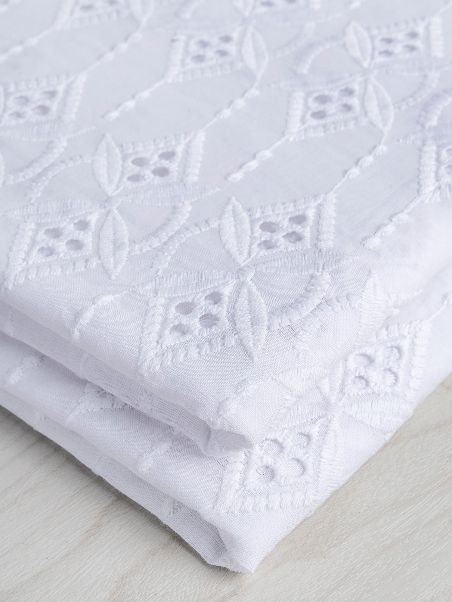 F-COT335-001-Ornament-Cotton-Eyelet-Deadstock-White-Core-Fabrics-fold