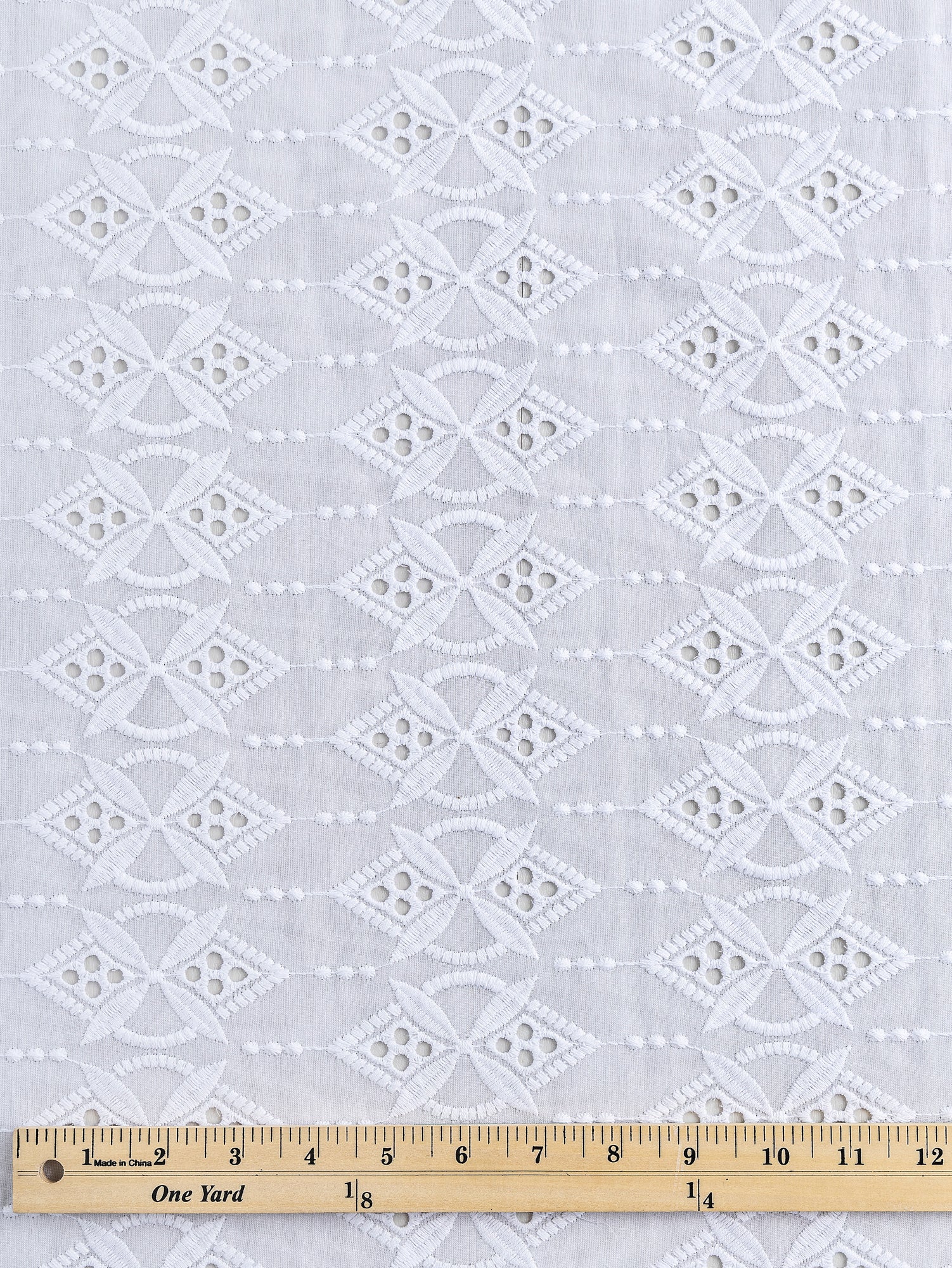 F-COT335-001-Ornament-Cotton-Eyelet-Deadstock-White-Core-Fabrics-ruler
