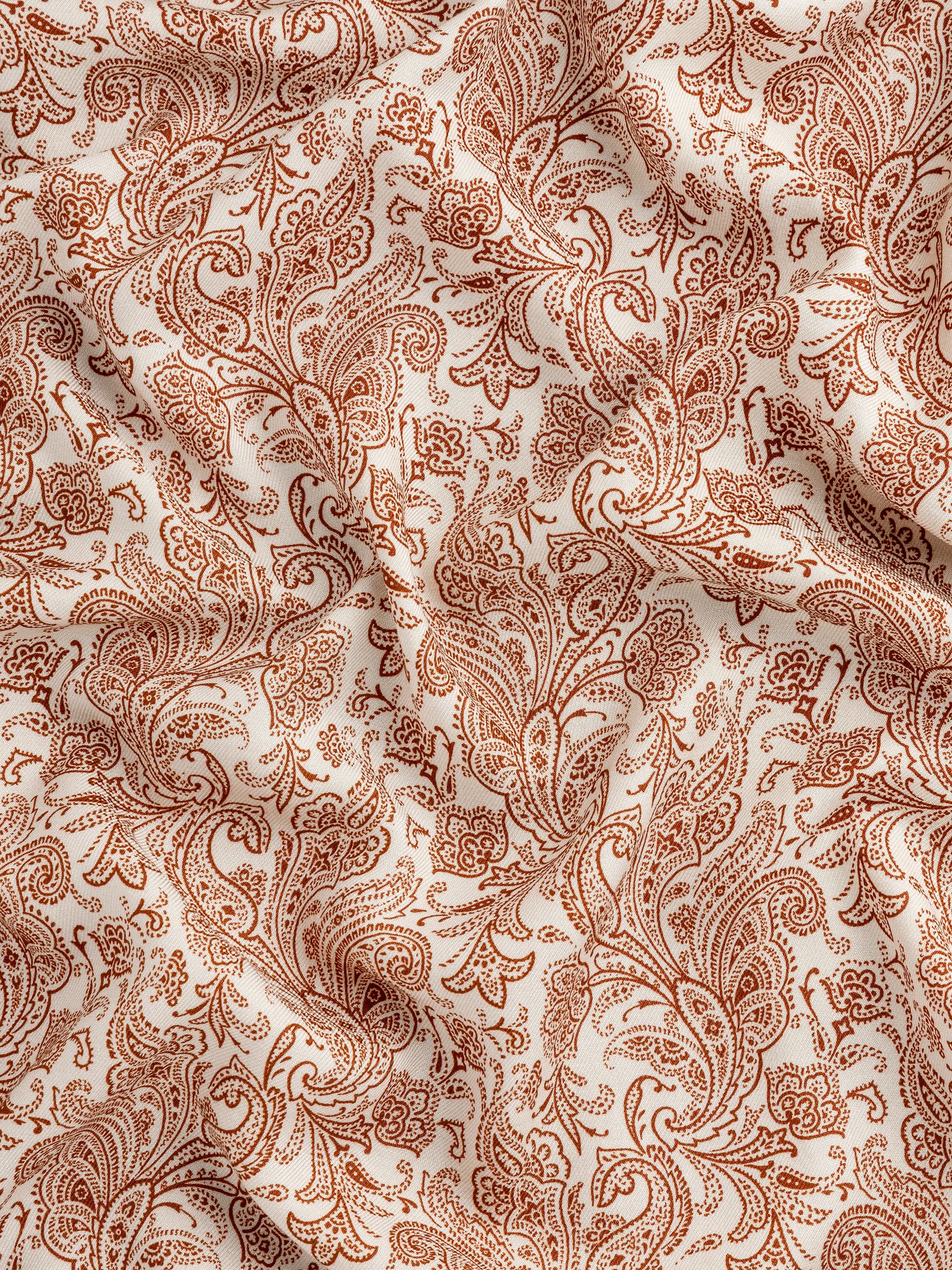 F-DEA149-Paisley-Print-Viscose-Twill-Deadstock-Cream-and-Rust-Core-Fabrics-scrunched.webp