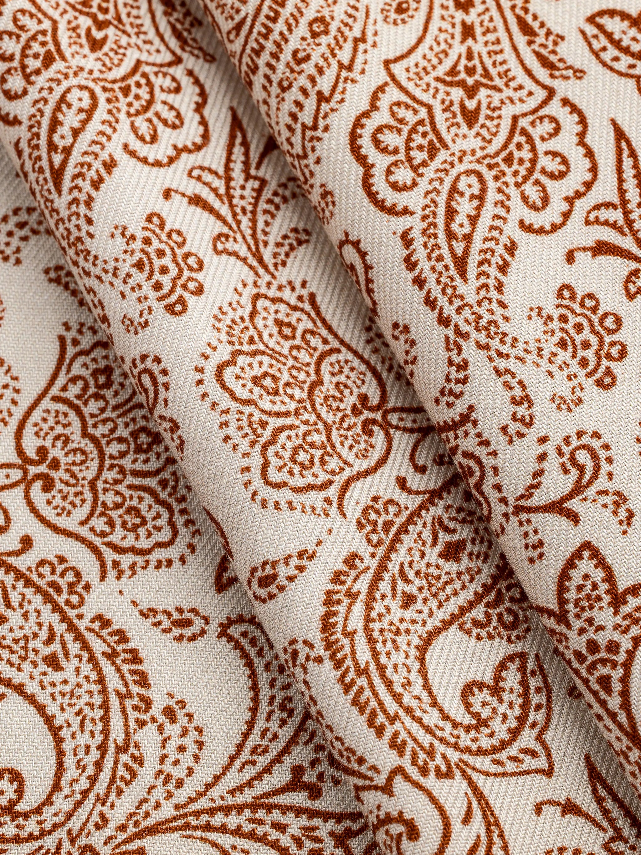 F-DEA149-Paisley-Print-Viscose-Twill-Deadstock-Cream-and-Rust-Core-Fabrics-fold.webp