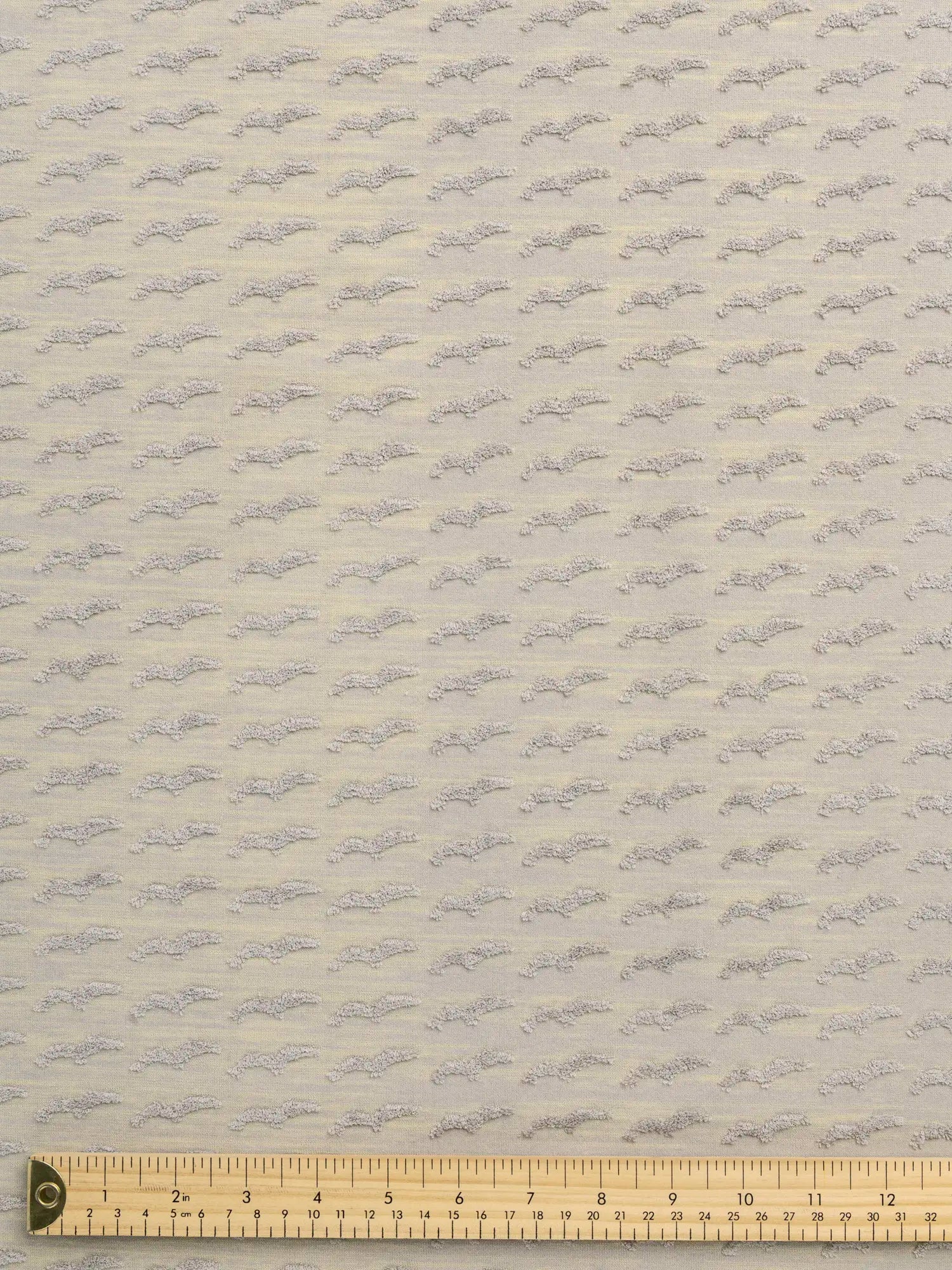 F-DEA157-Patterned-French-Terry-Knit-Deadstock-Heather-Grey-and-Yellow-Core-Fabrics-ruler.webp