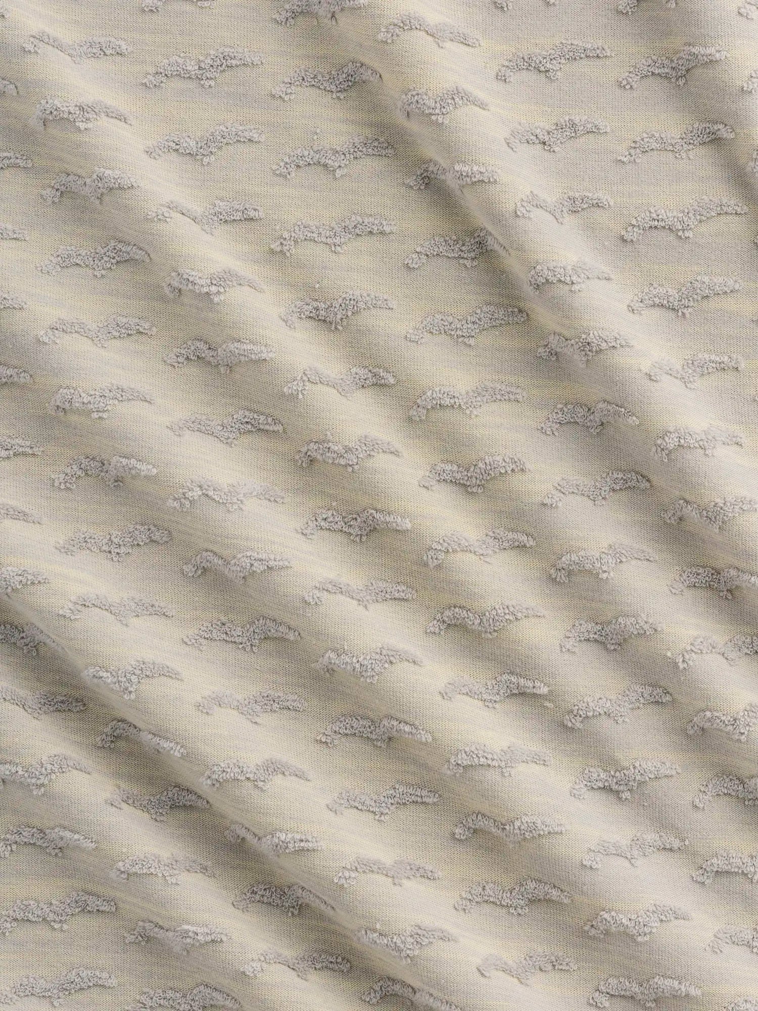 F-DEA157-Patterned-French-Terry-Knit-Deadstock-Heather-Grey-and-Yellow-Core-Fabrics-scrunched.webp