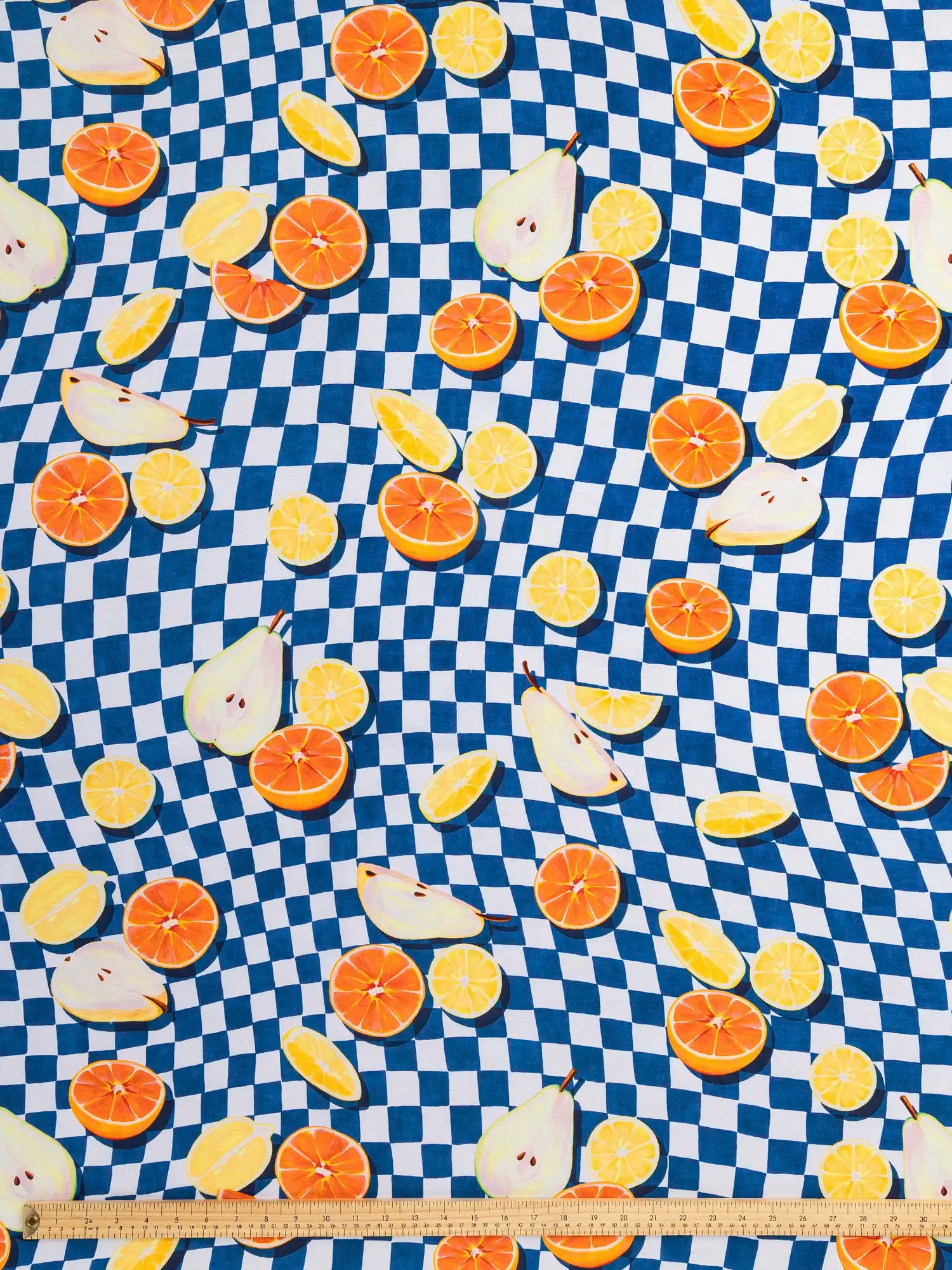 F-COT469-Pear-Pressure-Check-Print-Organic-Cotton-Linen-Cobalt-White-Orange-and-Lemon-Core-Fabrics-ruler.webp