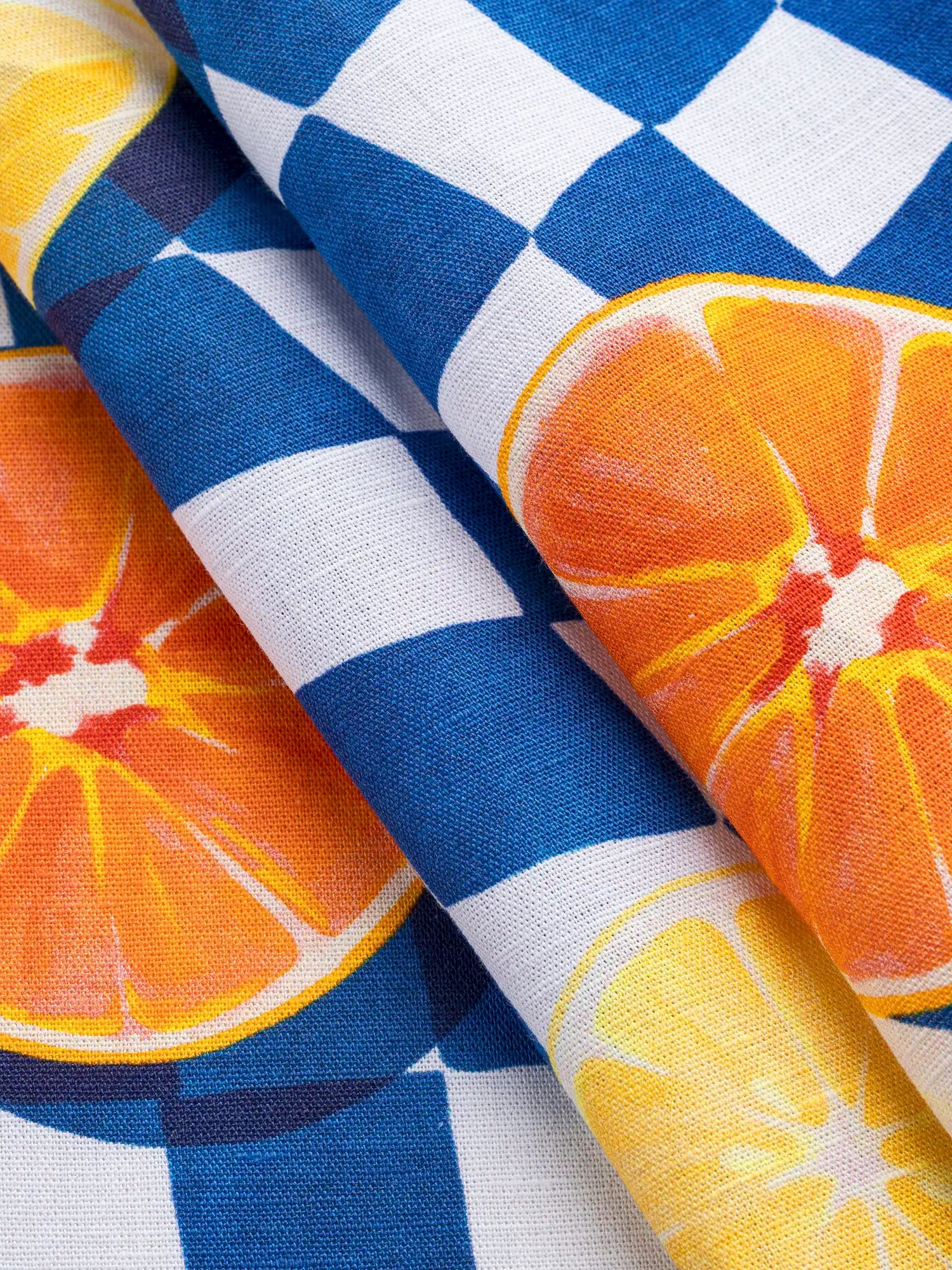 F-COT469-Pear-Pressure-Check-Print-Organic-Cotton-Linen-Cobalt-White-Orange-and-Lemon-Core-Fabrics-fold.webp