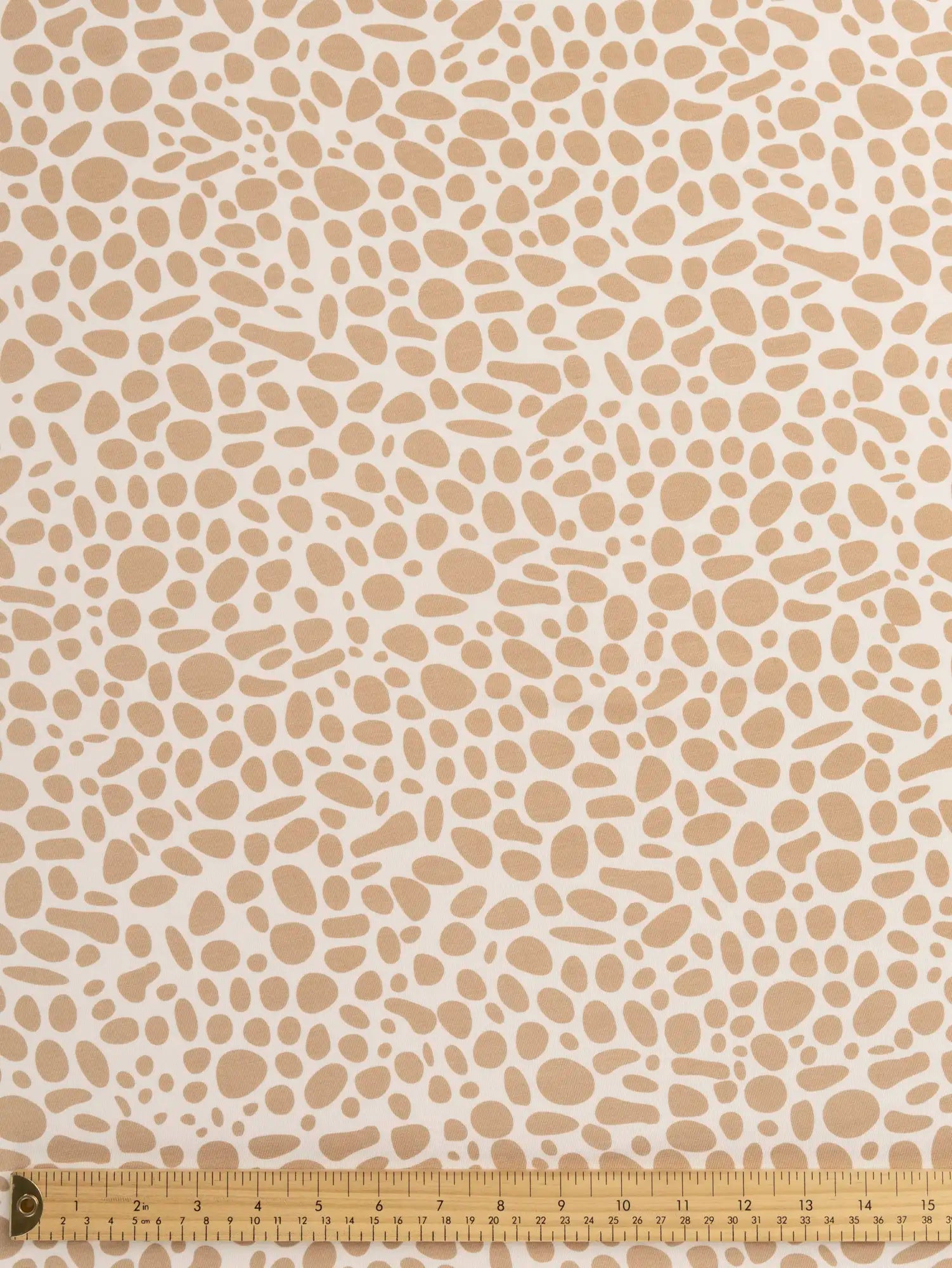 F-DEA235-Pebble-Print-Bamboo-Spandex-Knit-Deadstock-Ivory-and-Sand-Core-Fabrics-ruler.webp