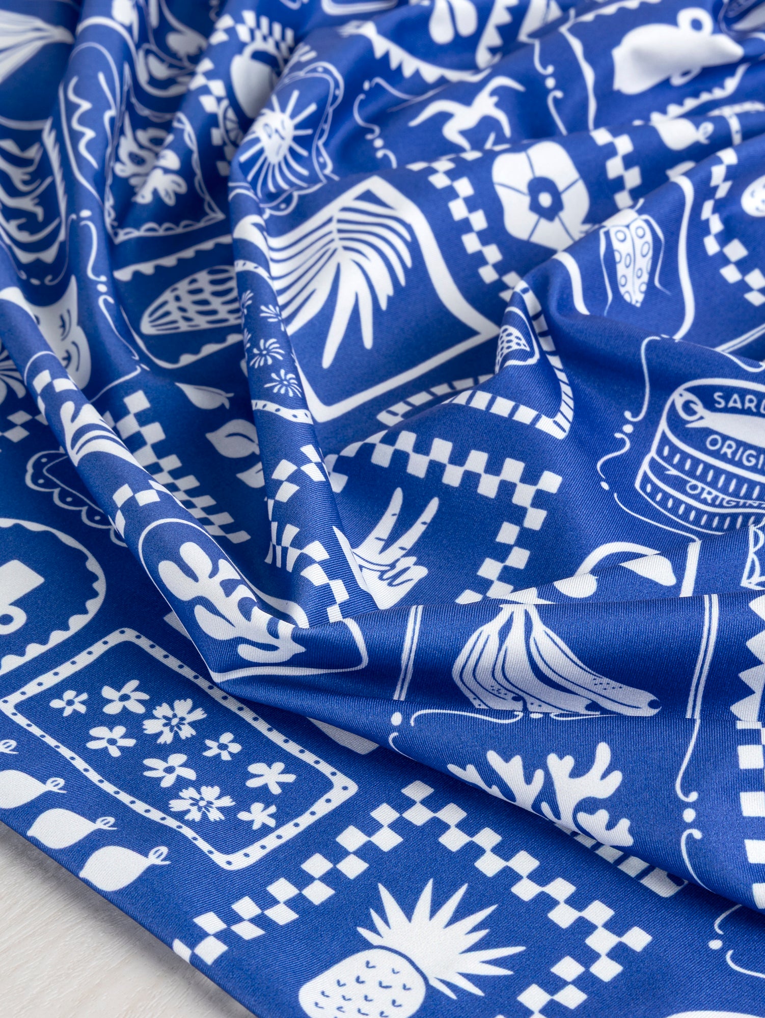 F-PES037-Picnic-Tile-Print-Recycled-Swim-Performance-Knit-Royal-Blue-and-White-Core-Fabrics-scrunched.JPG