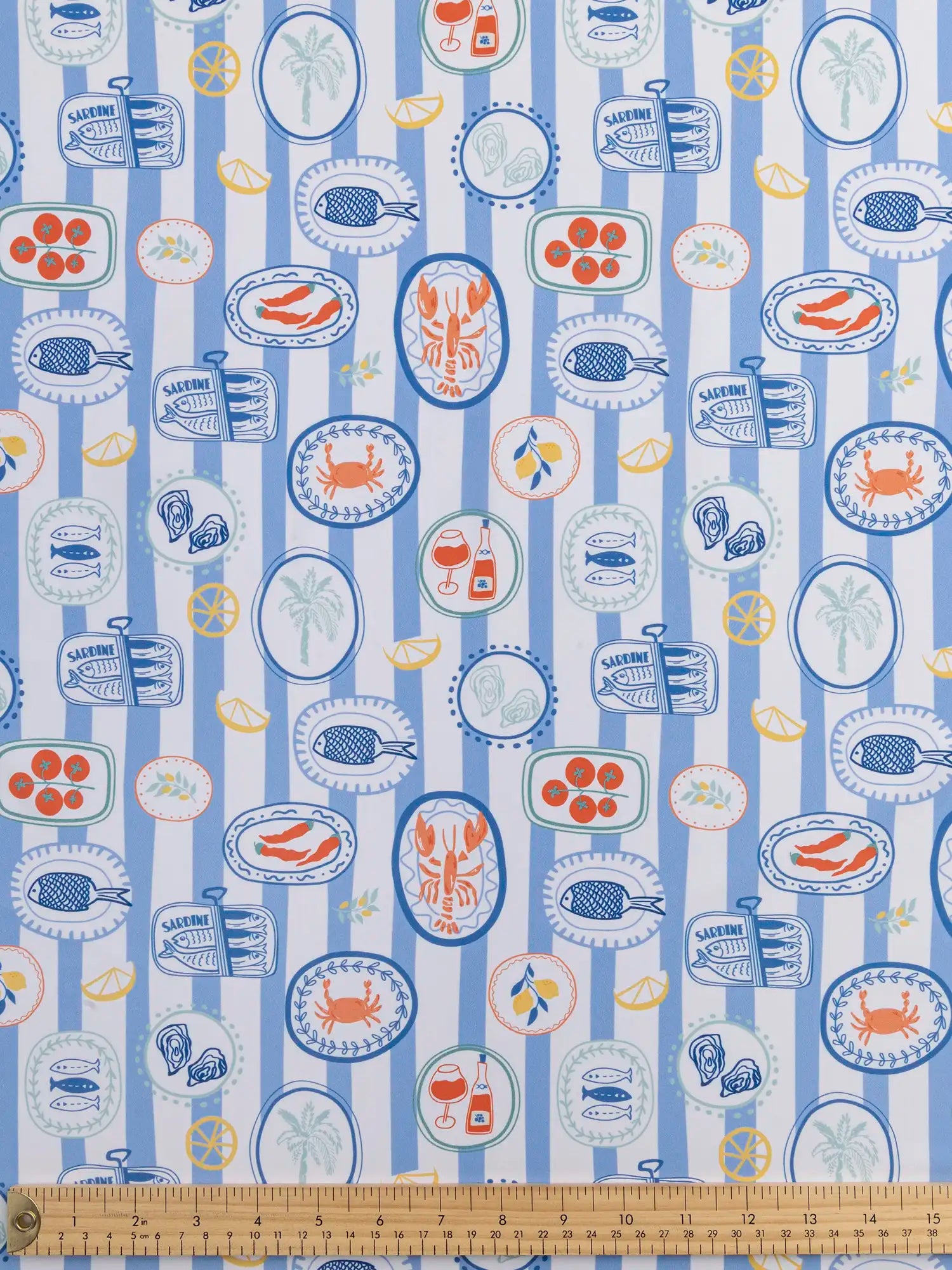 F-NYL023-Picnic-à-la-Mer-Print-Swim-Performance-Knit-Light-Blue-White-and-Multicolour-Core-Fabrics-ruler.webp