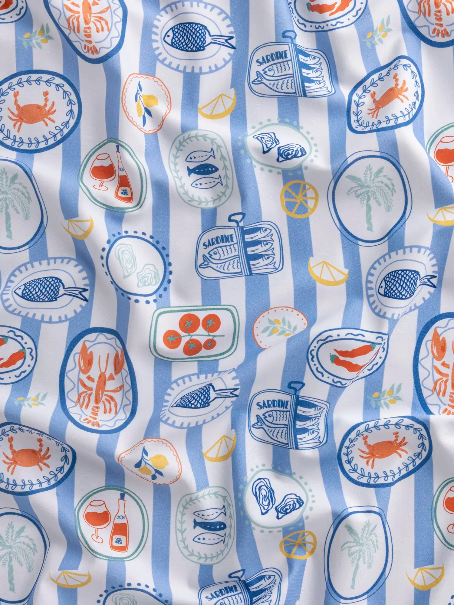 F-NYL023-Picnic-à-la-Mer-Print-Swim-Performance-Knit-Light-Blue-White-and-Multicolour-Core-Fabrics-scrunched.webp