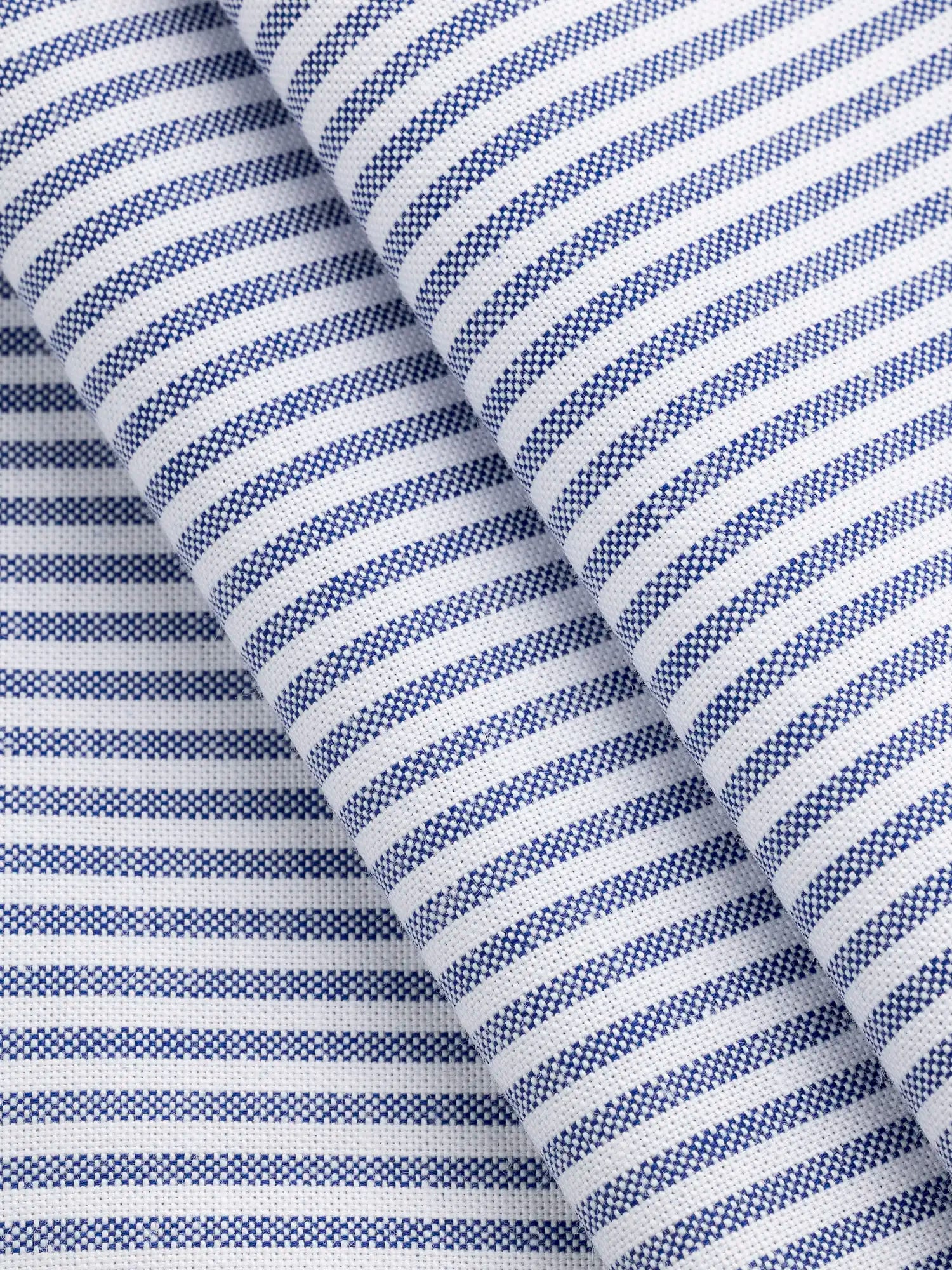 F-COT450-003-Pinpoint-Striped-Cotton-Oxford-Shirting-Indigo-and-White-Core-Fabrics-fold.webp